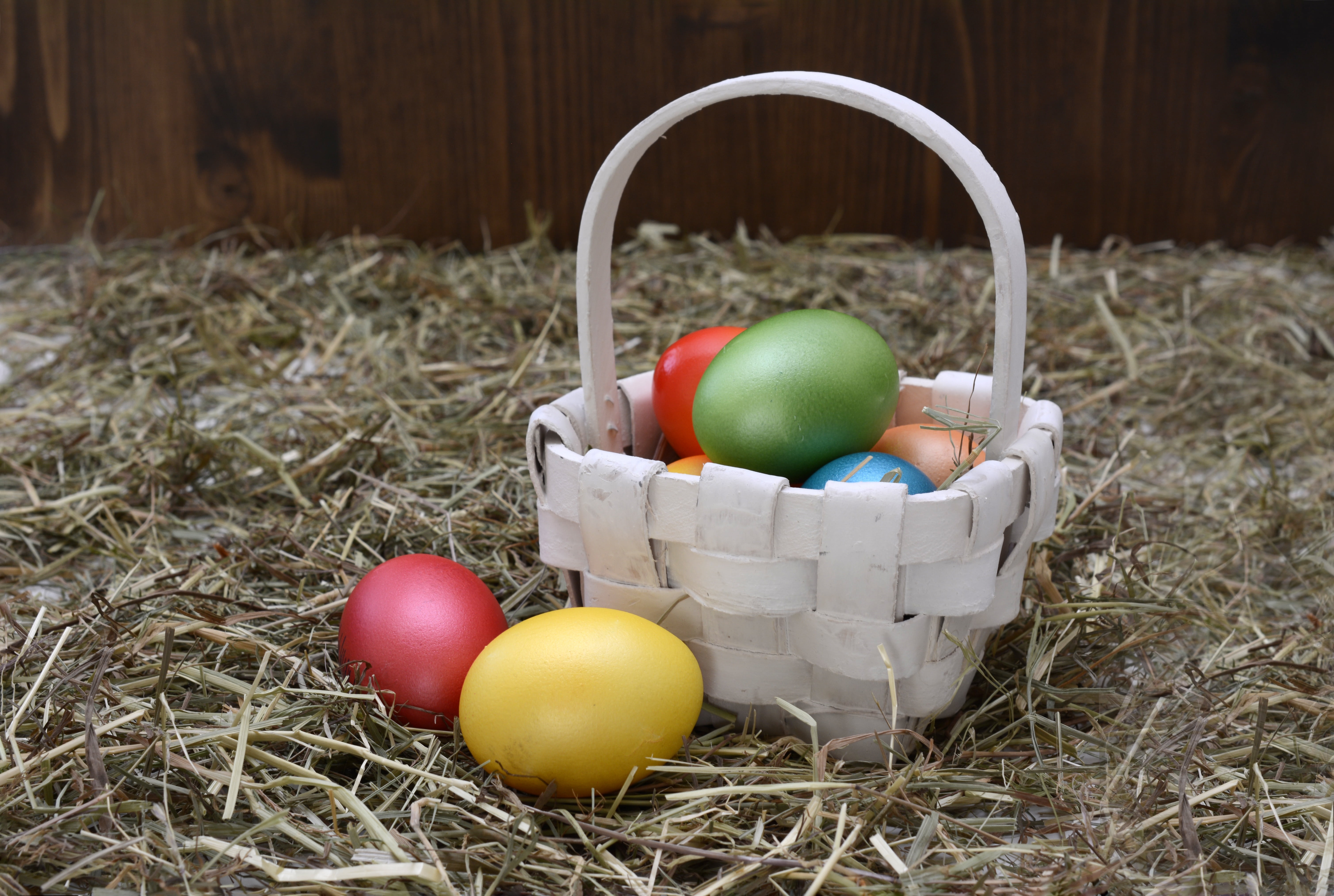 white wicker basket and easter eggs, easter nest, decoration