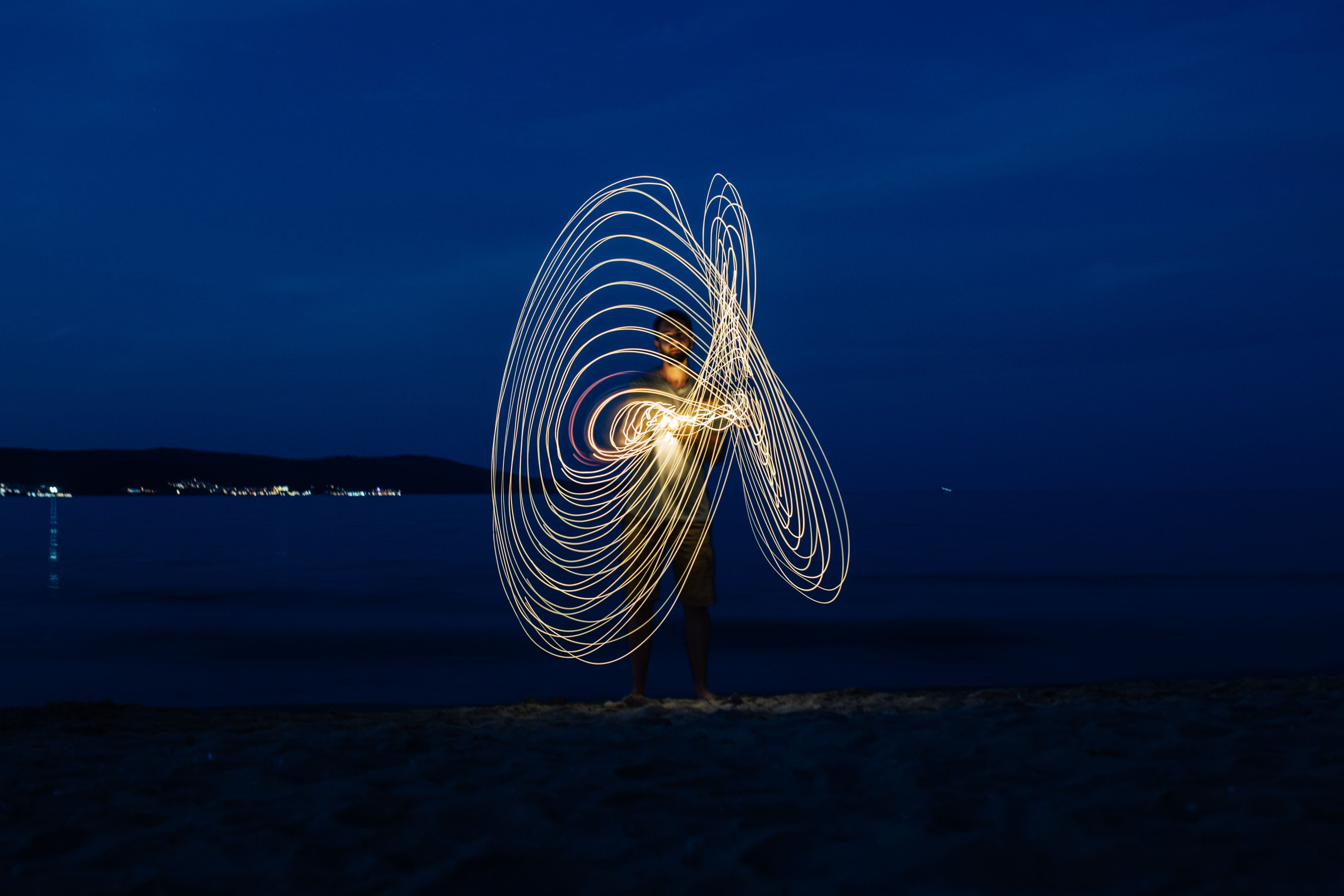 Light painting on the beach at nigh, ocean, sea, barbecue, night