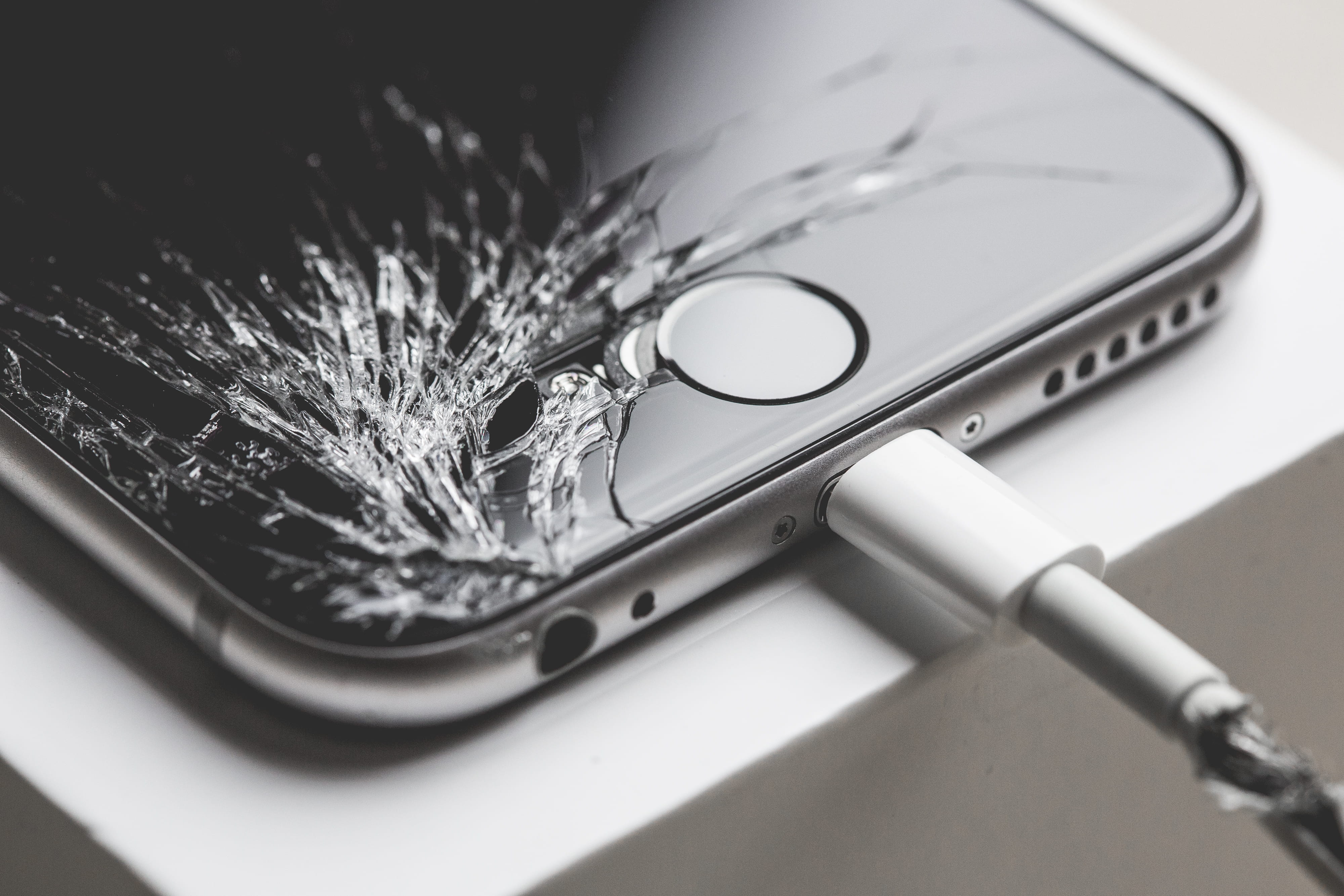 Crashed iPhone 6 with Cracked Screen Display, smashed, top, wrong