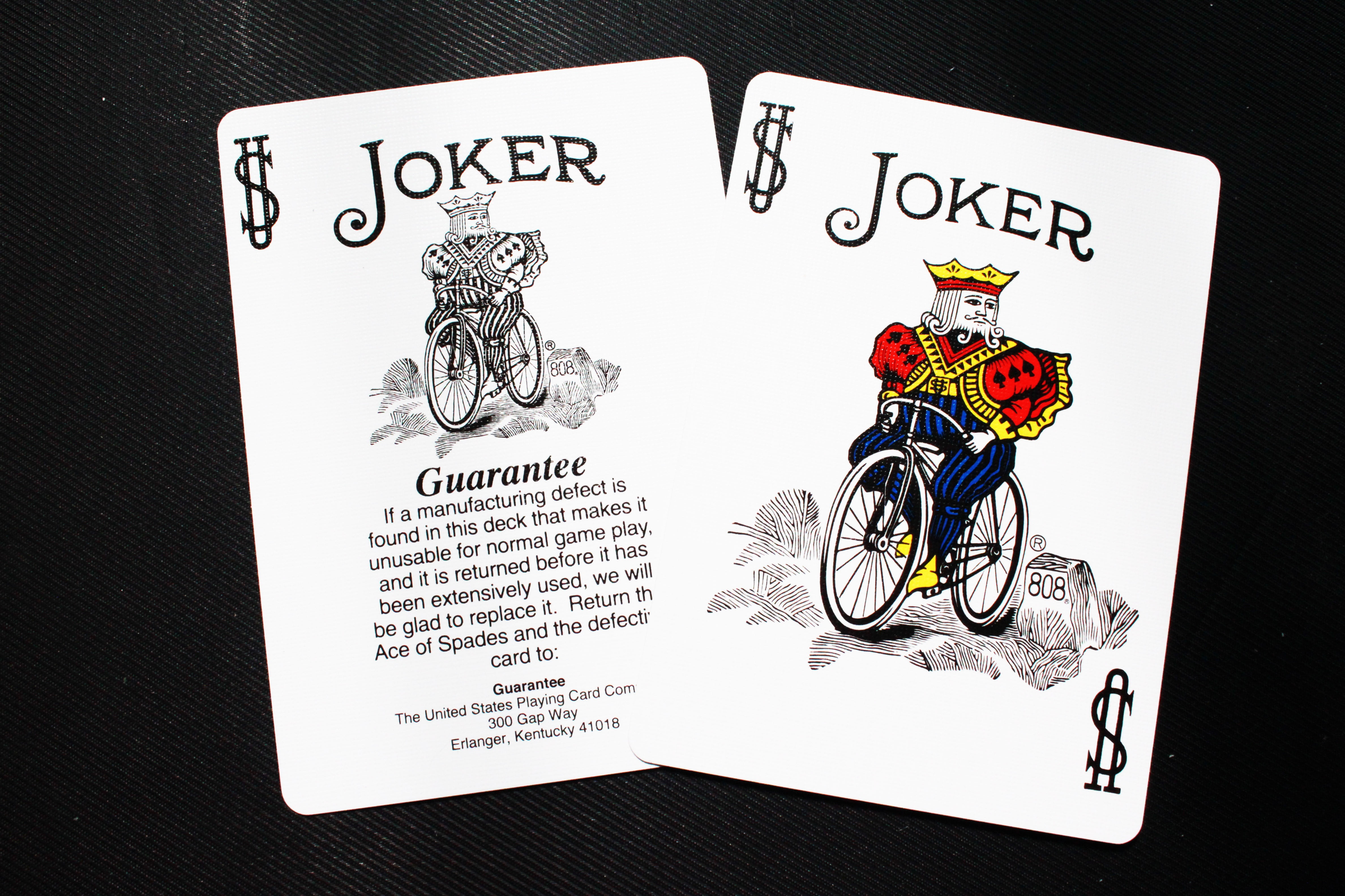 two Joker playing cards, deck, bicycle, magic cards, text, close-up
