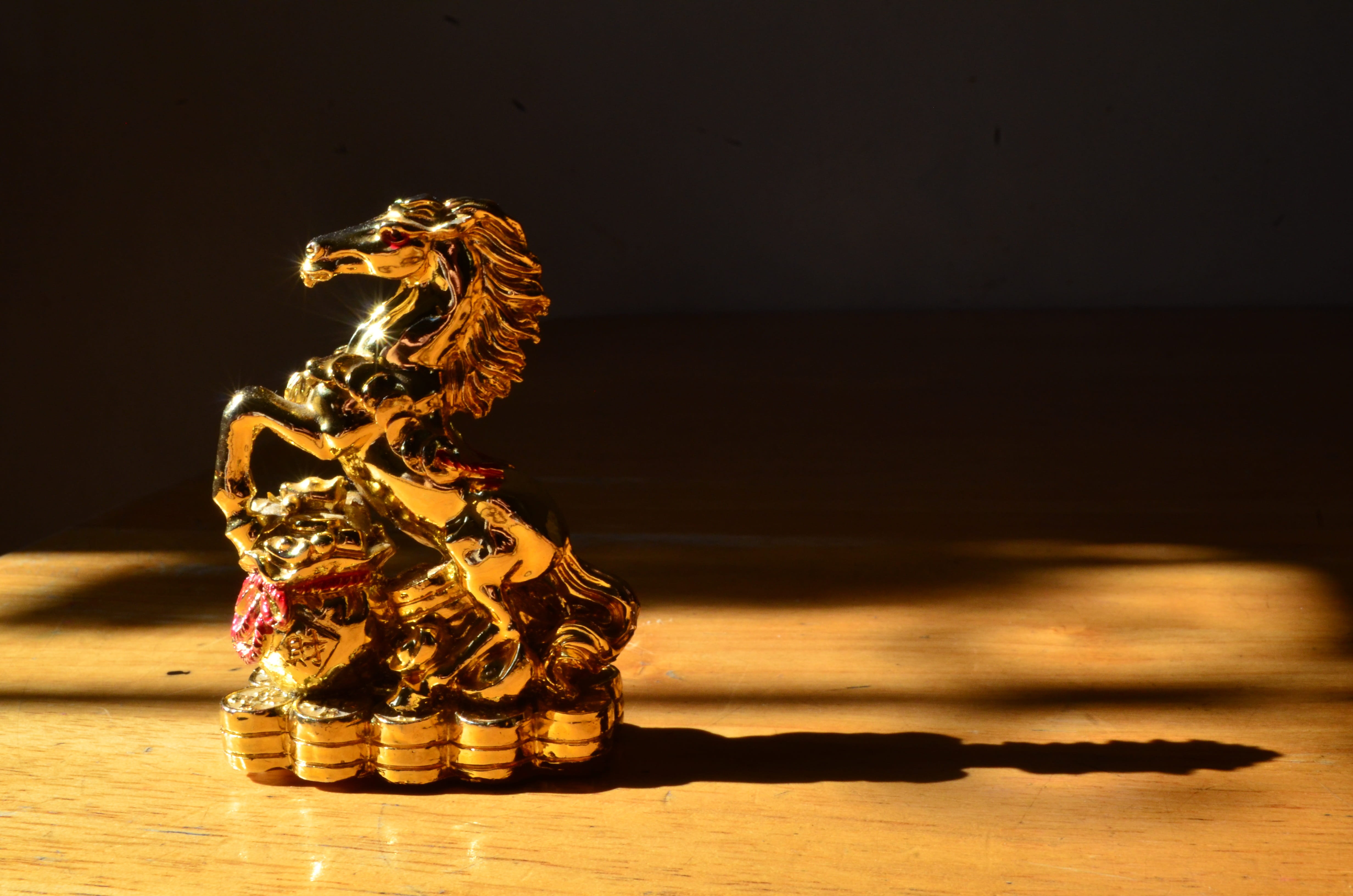 reflection, figurine, shadow, table, indoors, representation