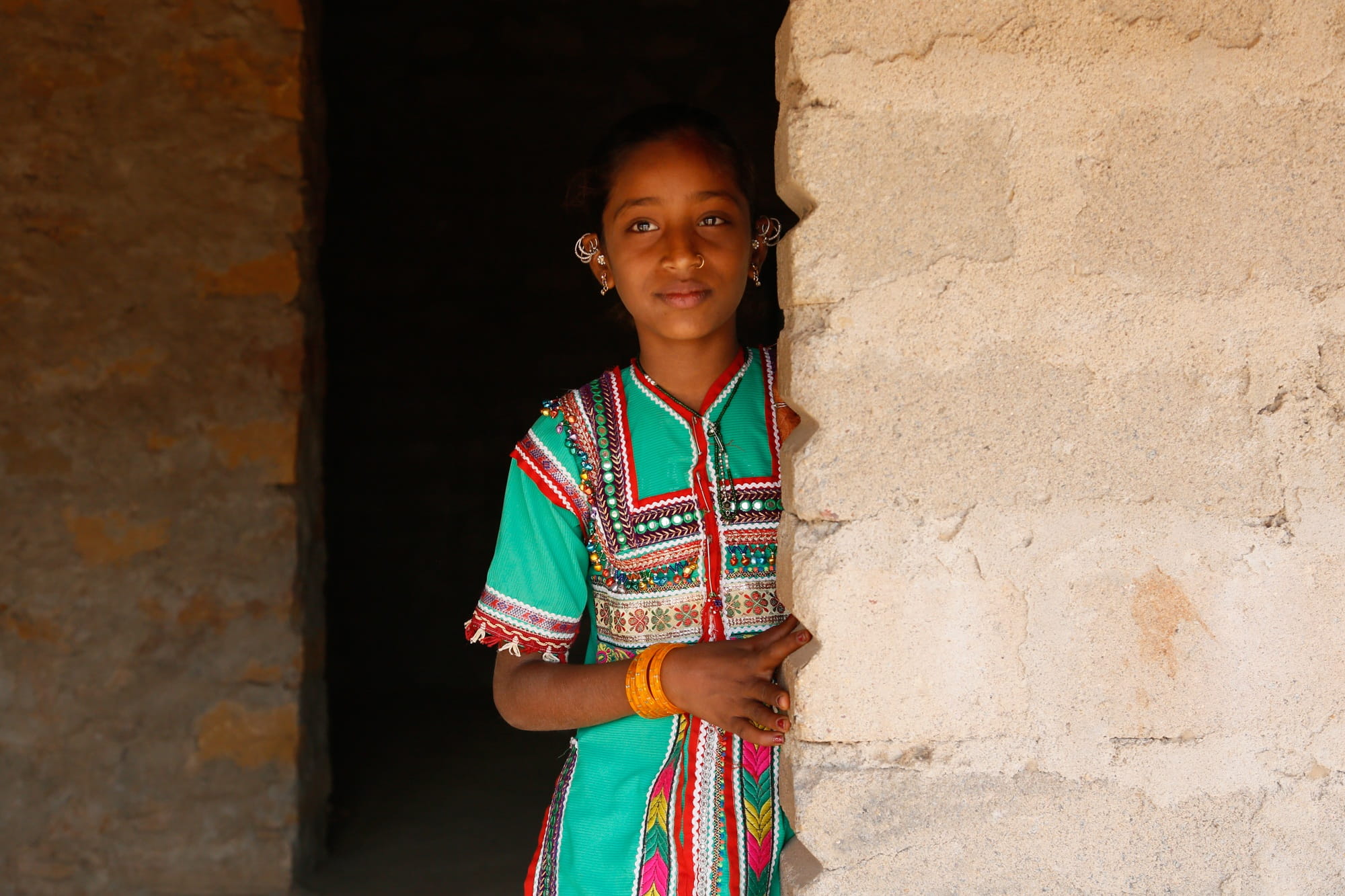 girl in teal and multicolored dress, Gujarat, Bhuj, India, Asia