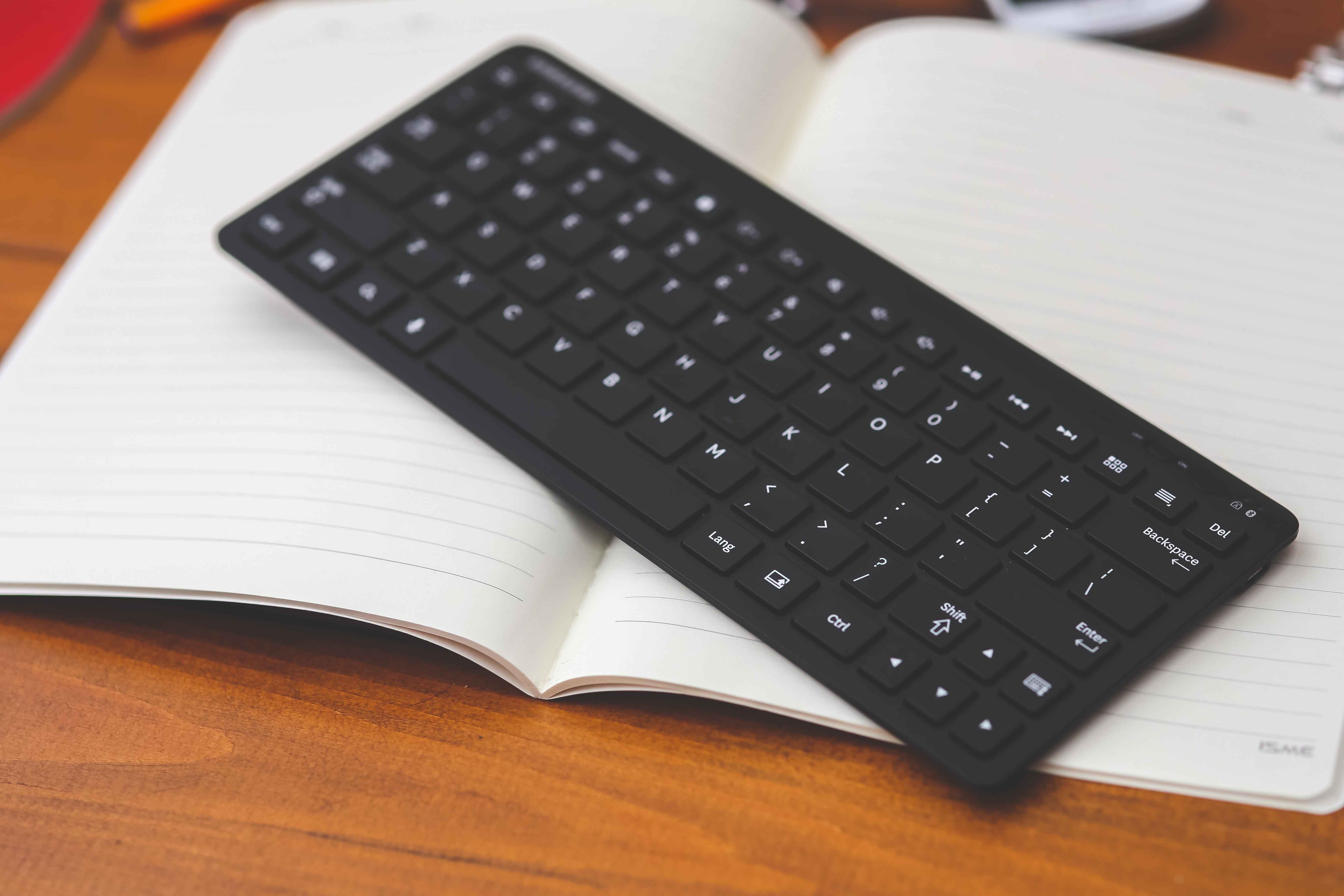 black wireless computer keyboard, technology, desktop, note, book
