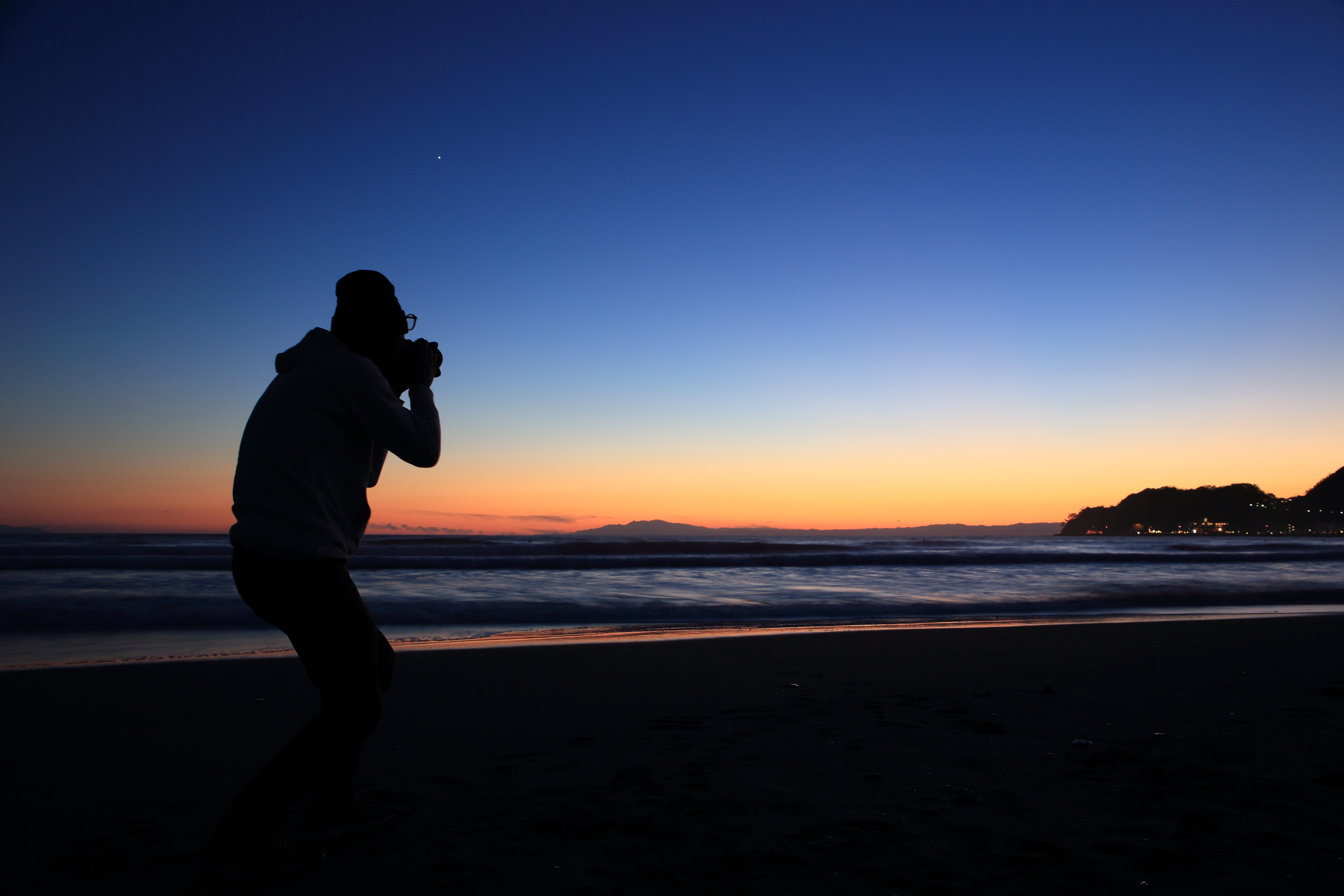 silhouette of person standing near seashore, photographer, click