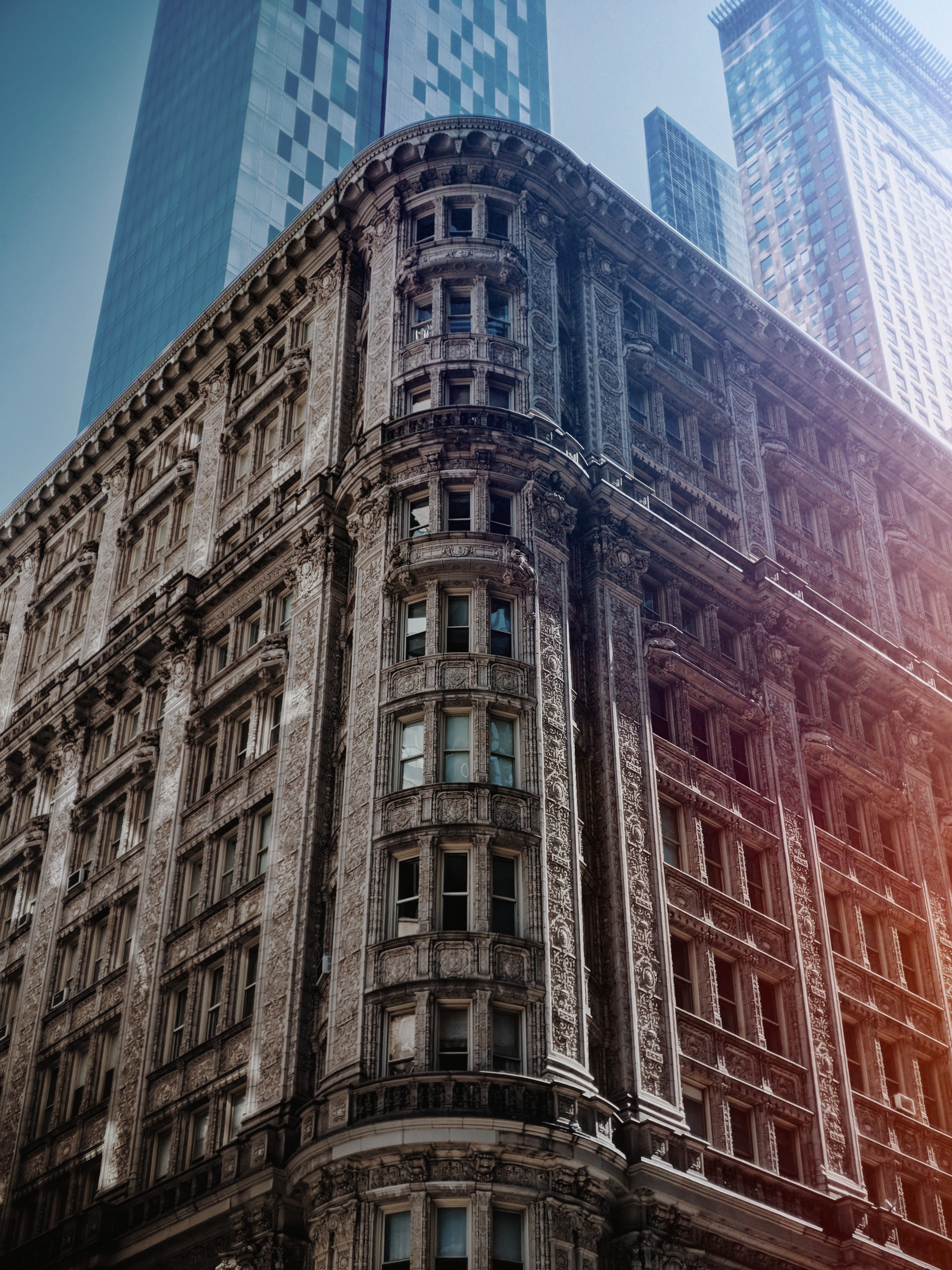 architectural photography of brown building, brown concrete building low-angle photo