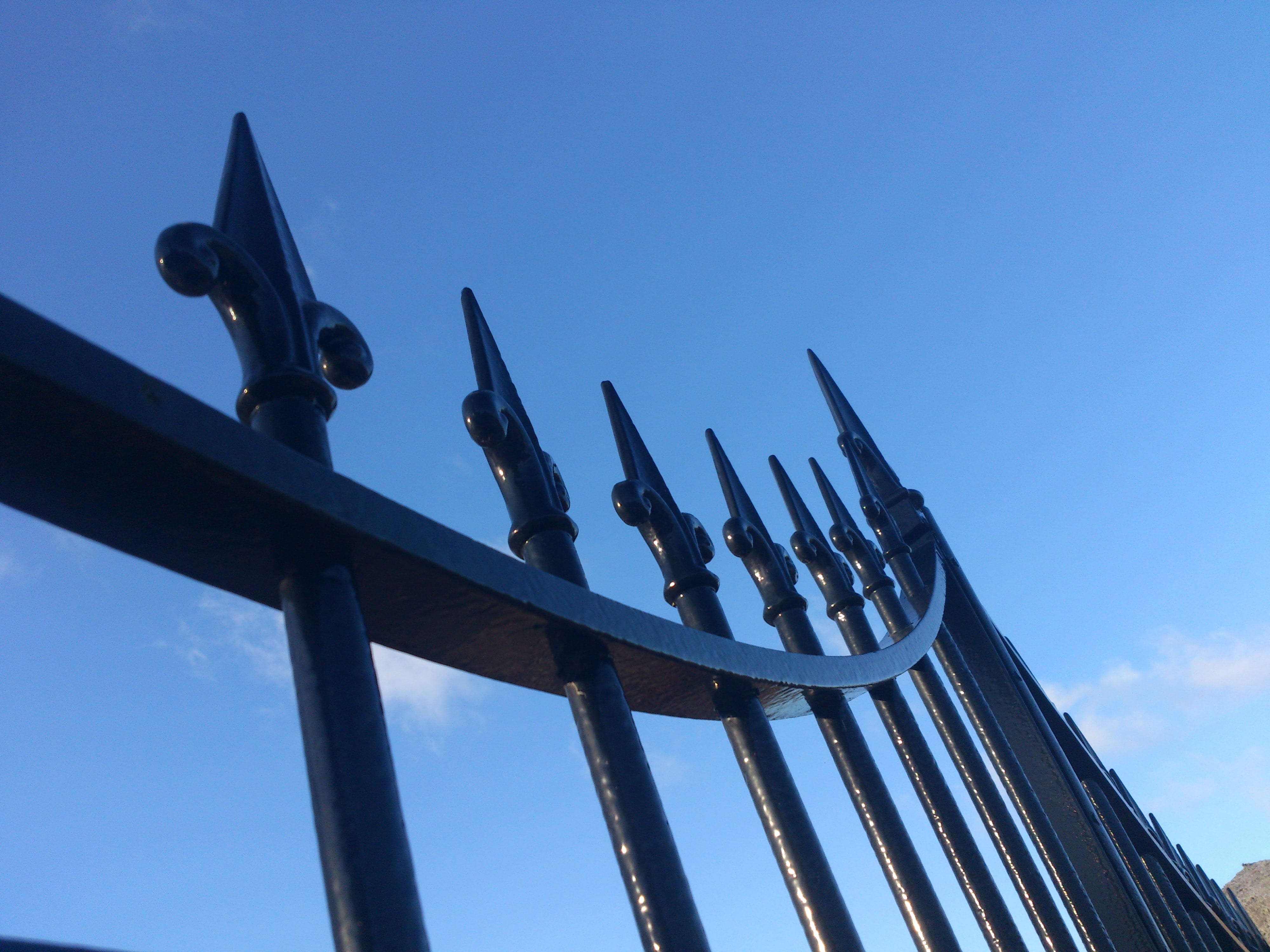 fences, iron, pattern, black, old, sky, blue, low angle view