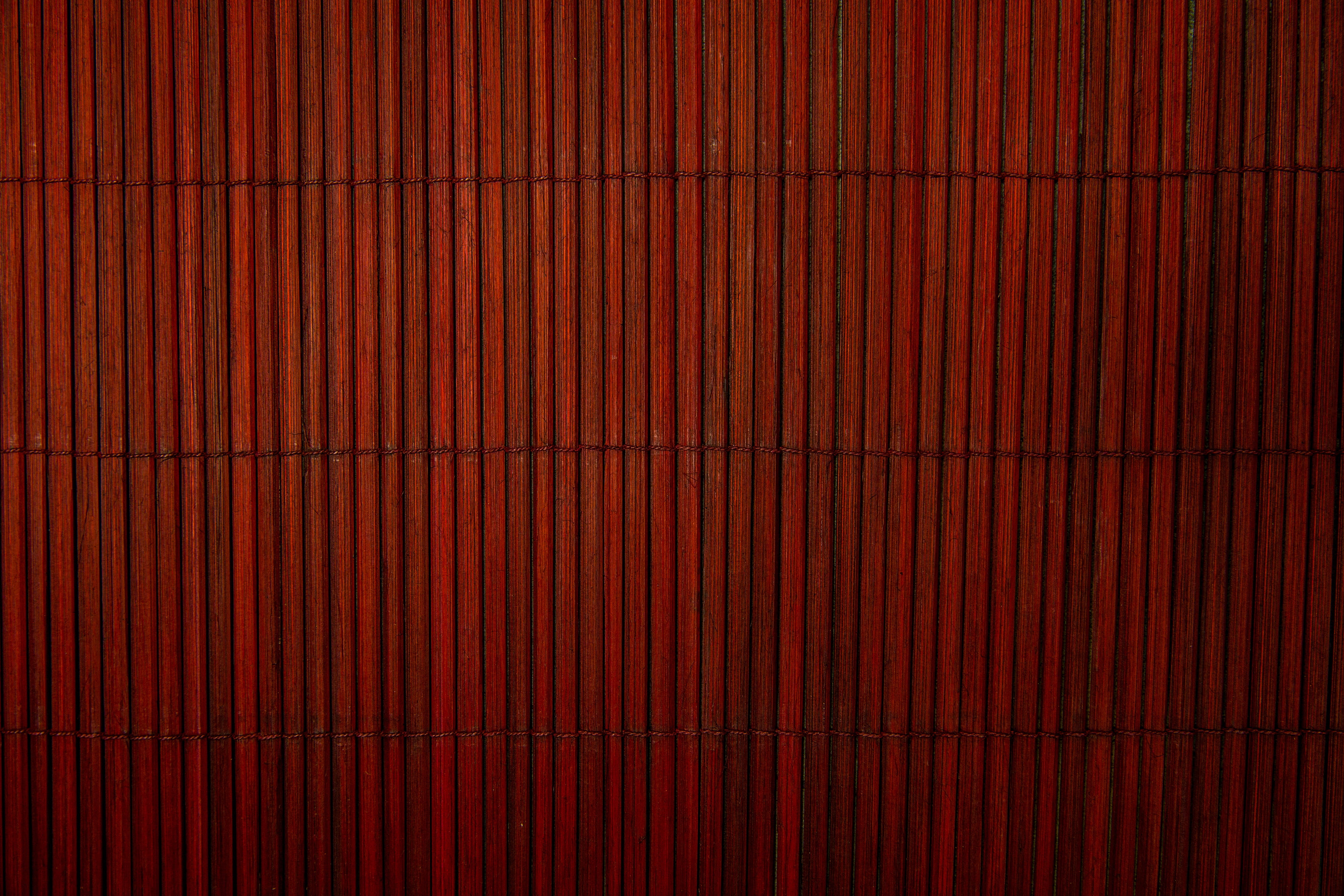 Closeup shot of a red bamboo wood texture, textures, backgrounds