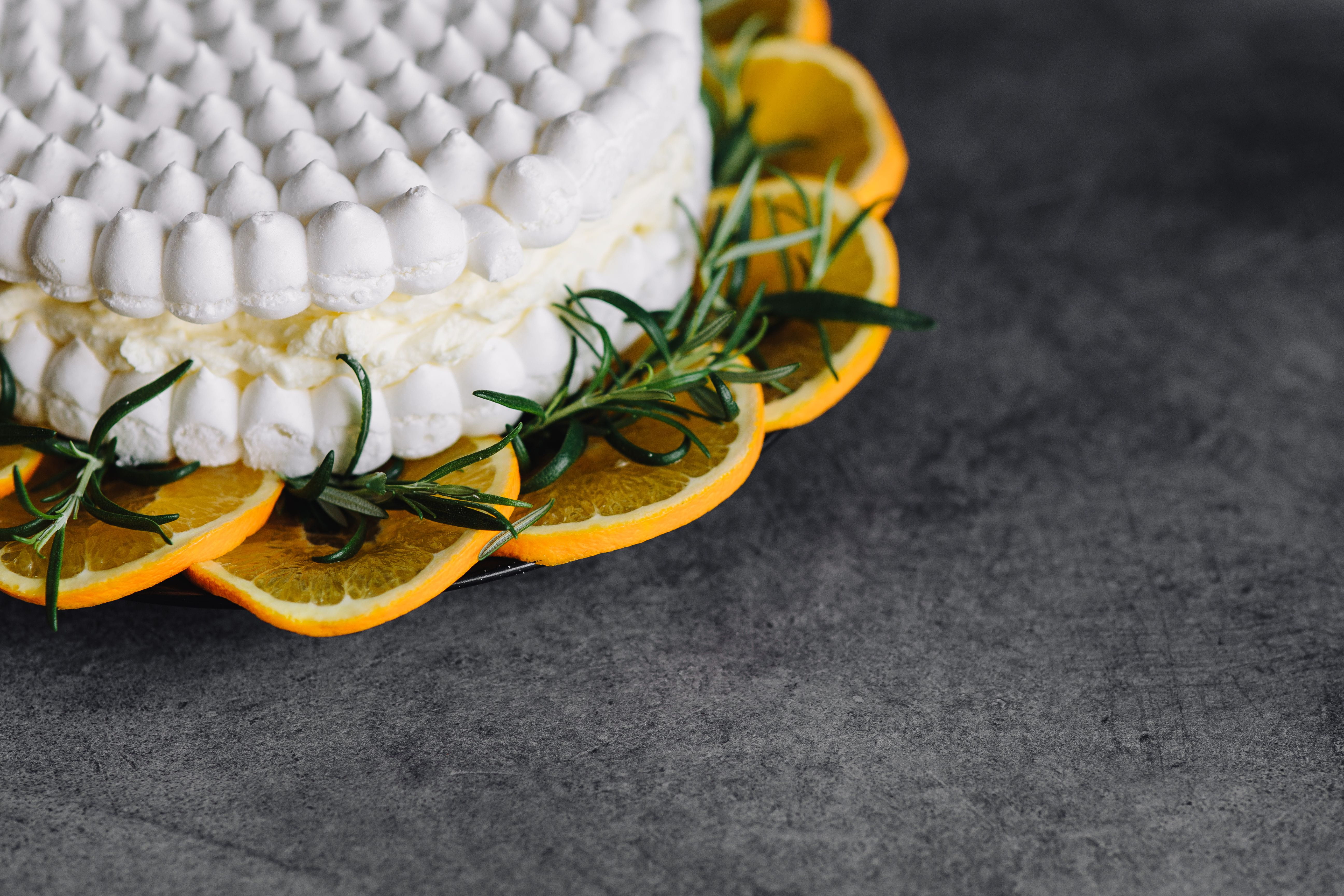 Meringue Cake with whipped cream and oranges, fruit, dessert