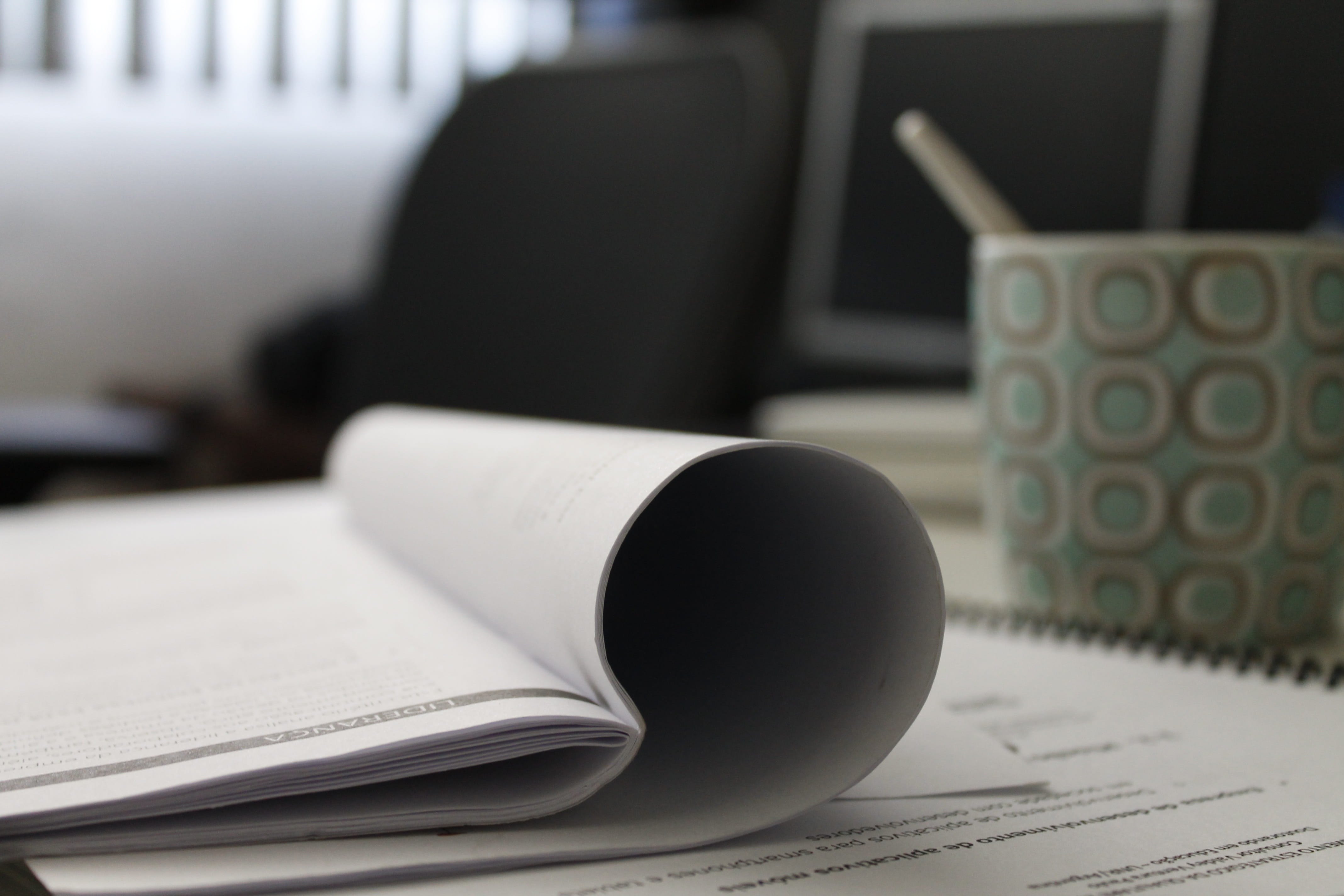 white book beside green and white ceramic mug, work, study, reading