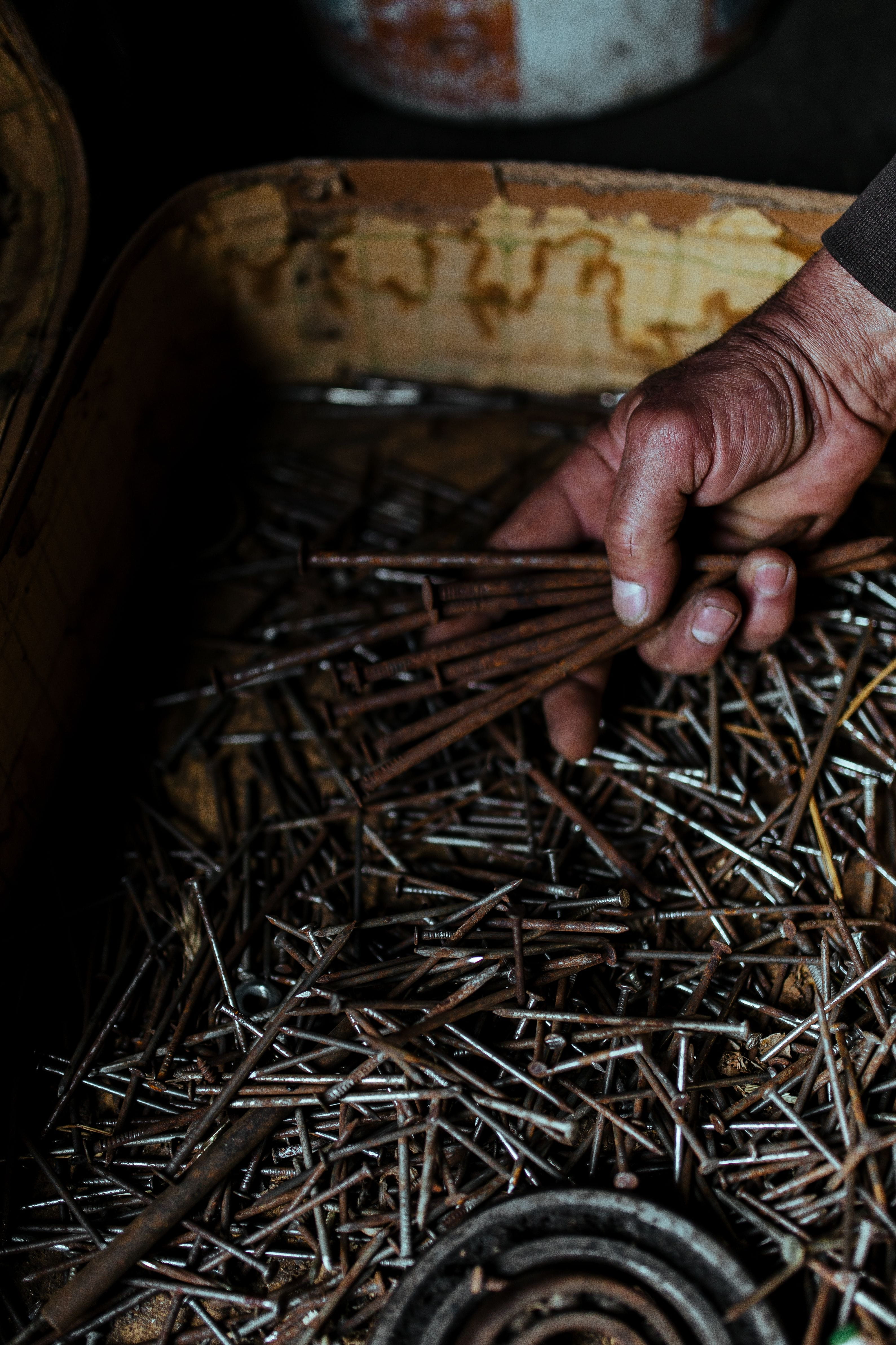 Tools, nails and bolts in a workshop, wooden, metal, nuts, diy