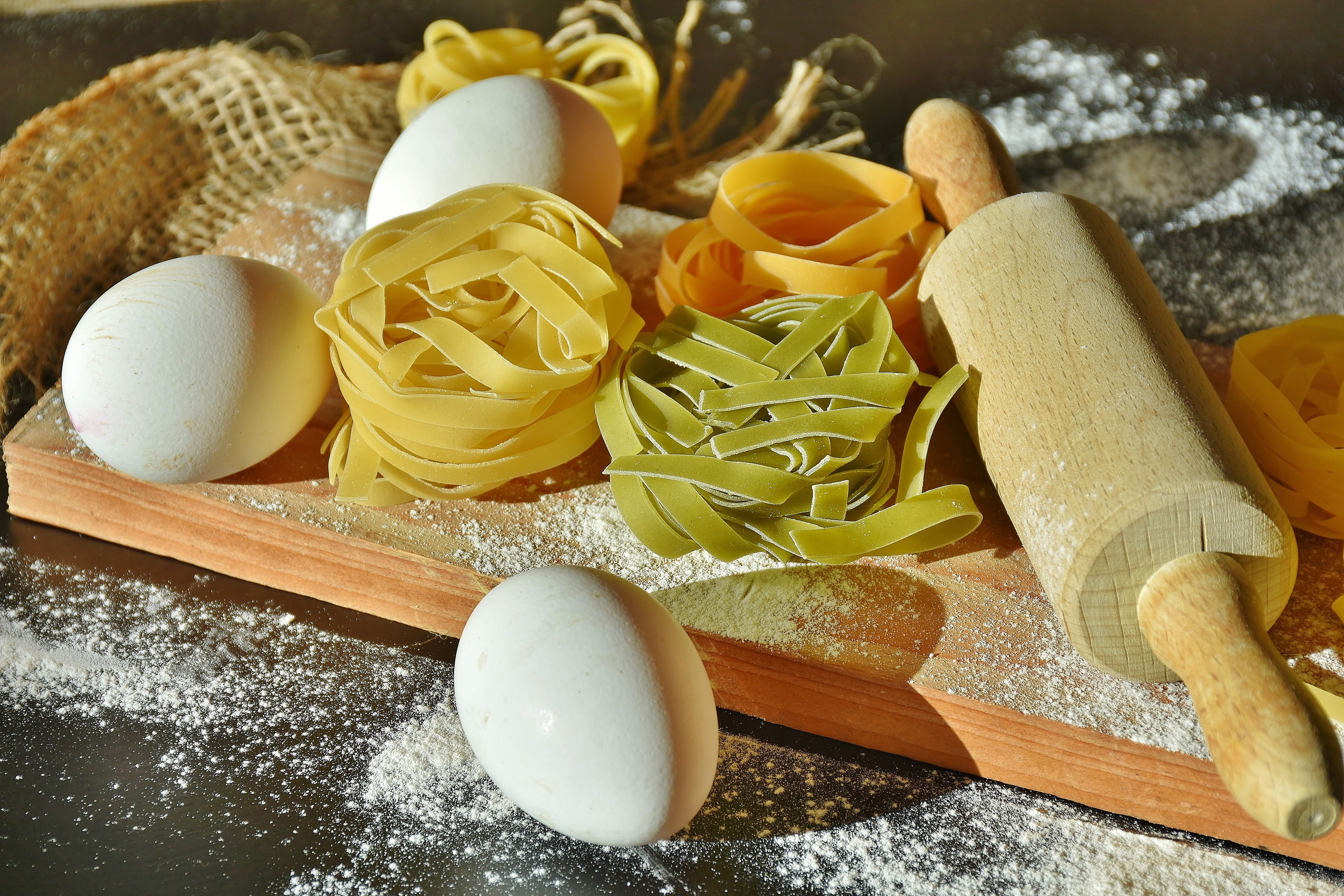 eggs and pasta with wooden rolling pin, noodles, tagliatelle