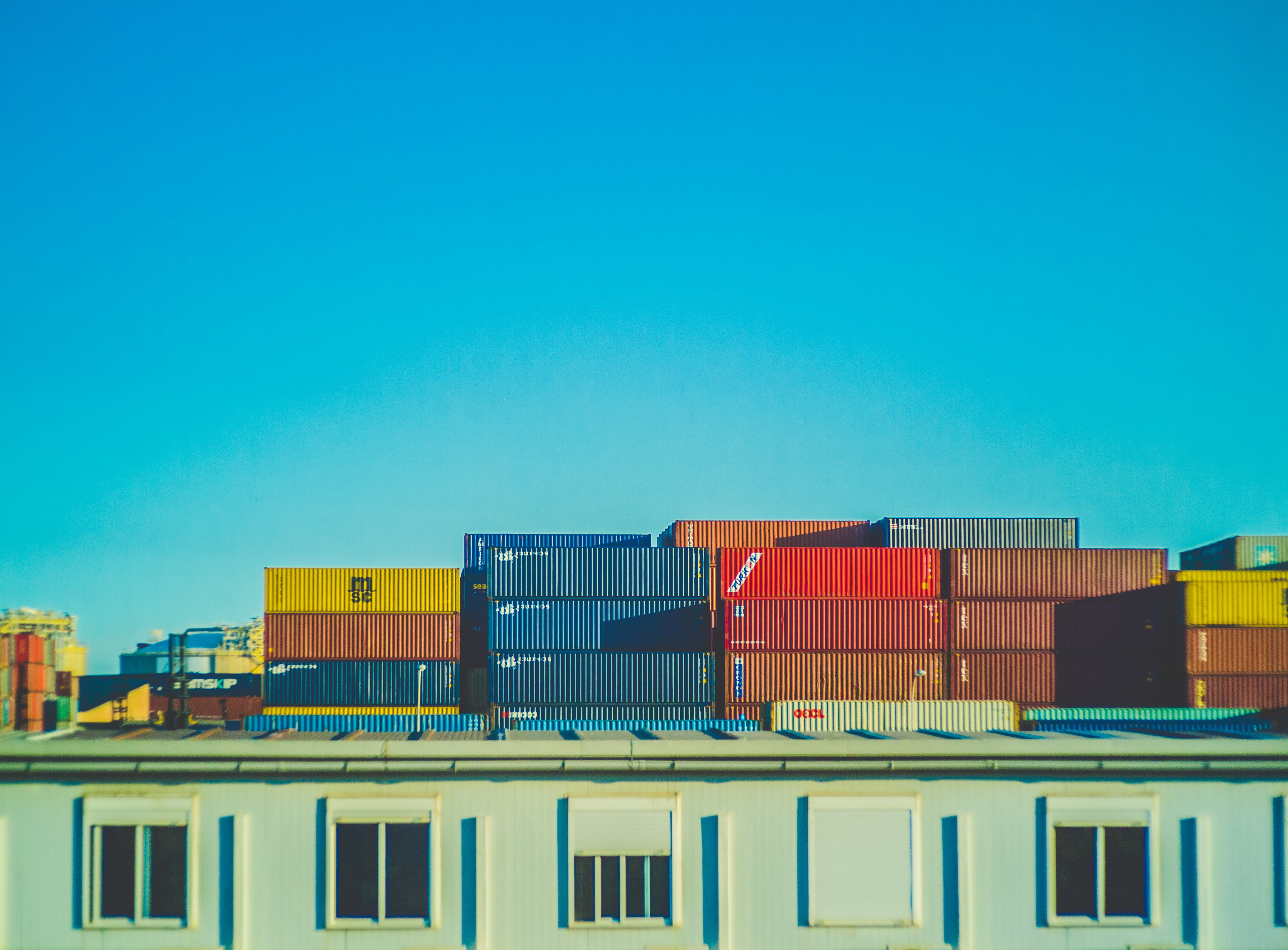 assorted-color intermodal container lot, assorted-color intermodal container on port
