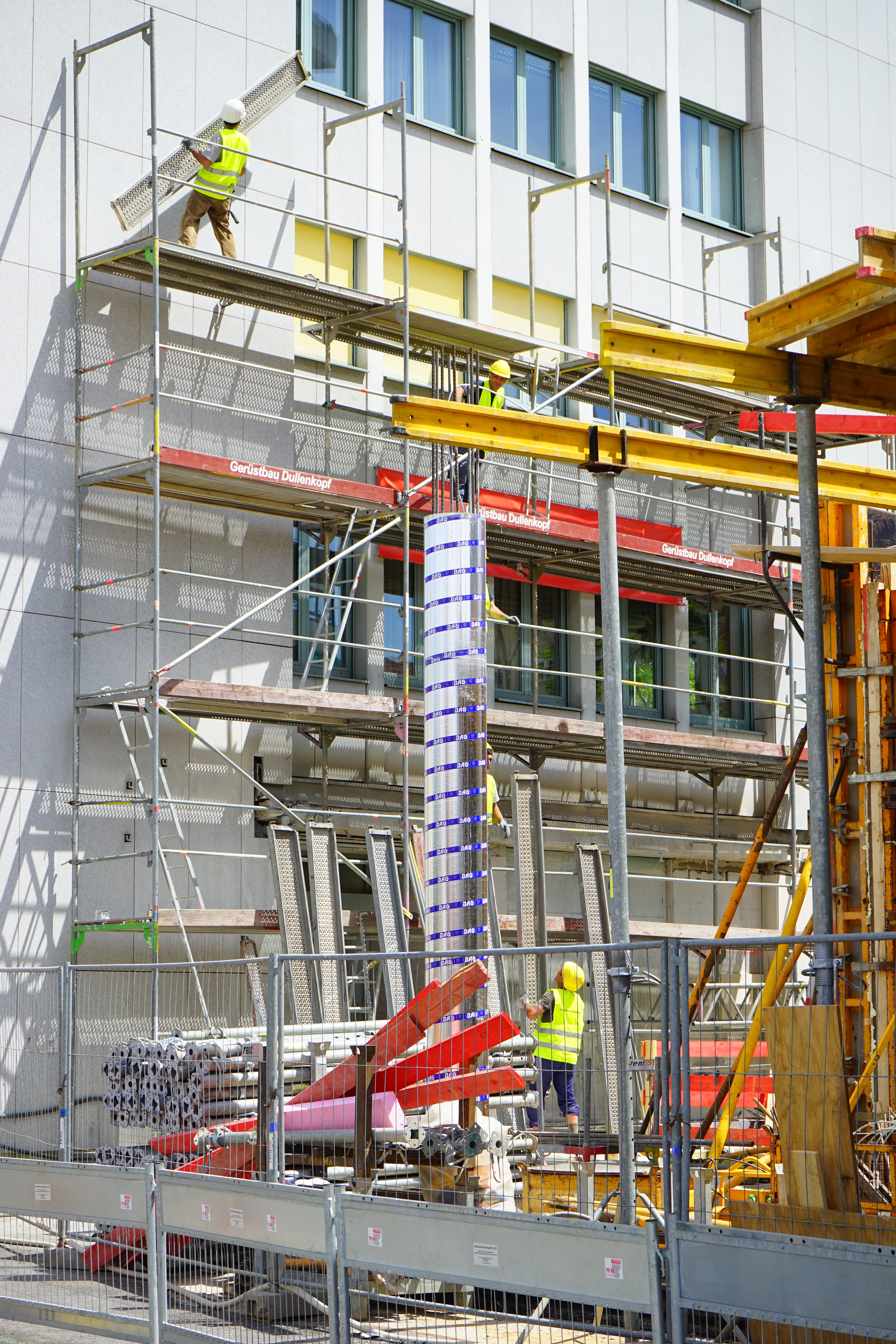 several construction workers on scaffolding, New Building, site