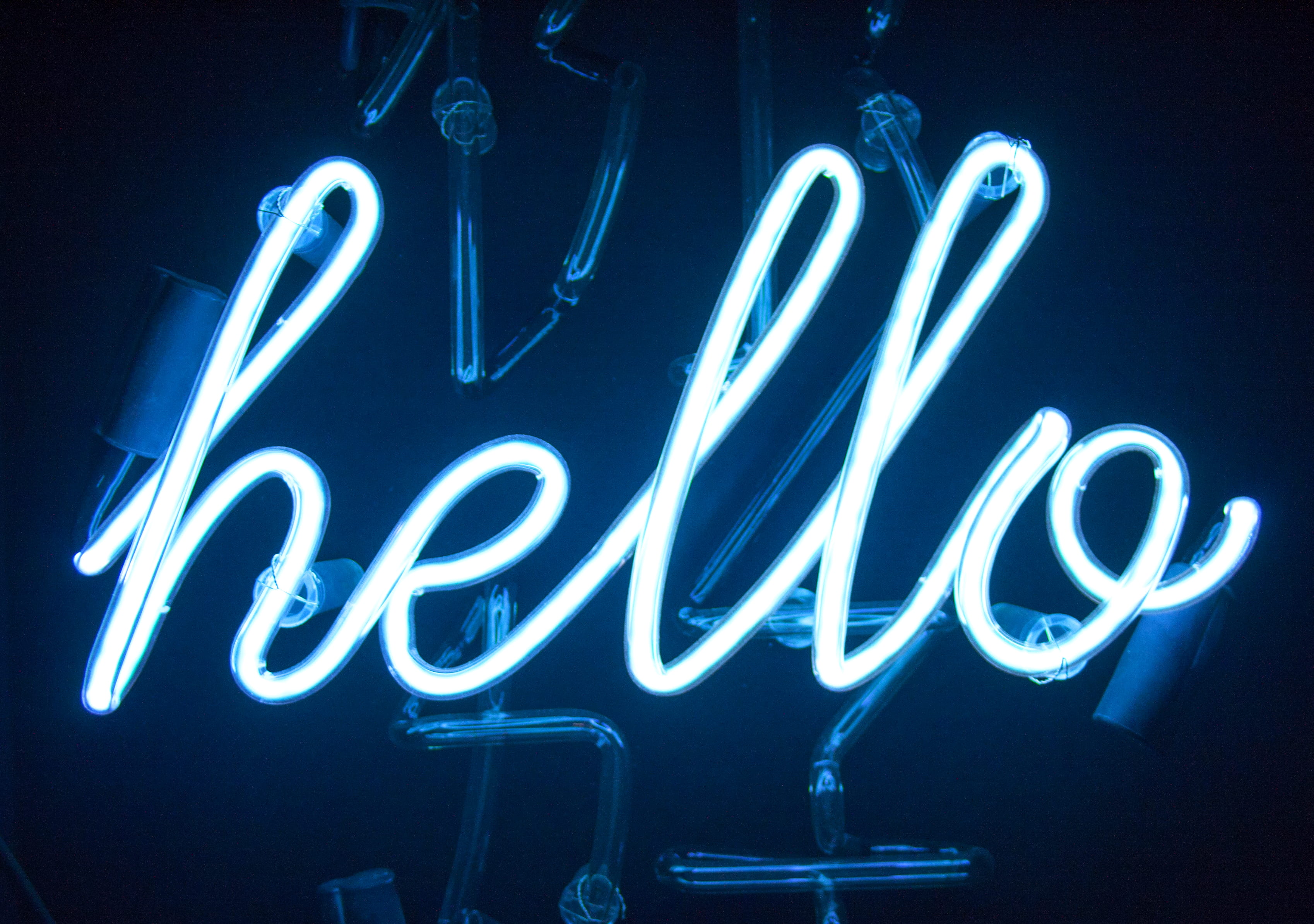 Hello Neon light signage, close shot of white hello neon signage