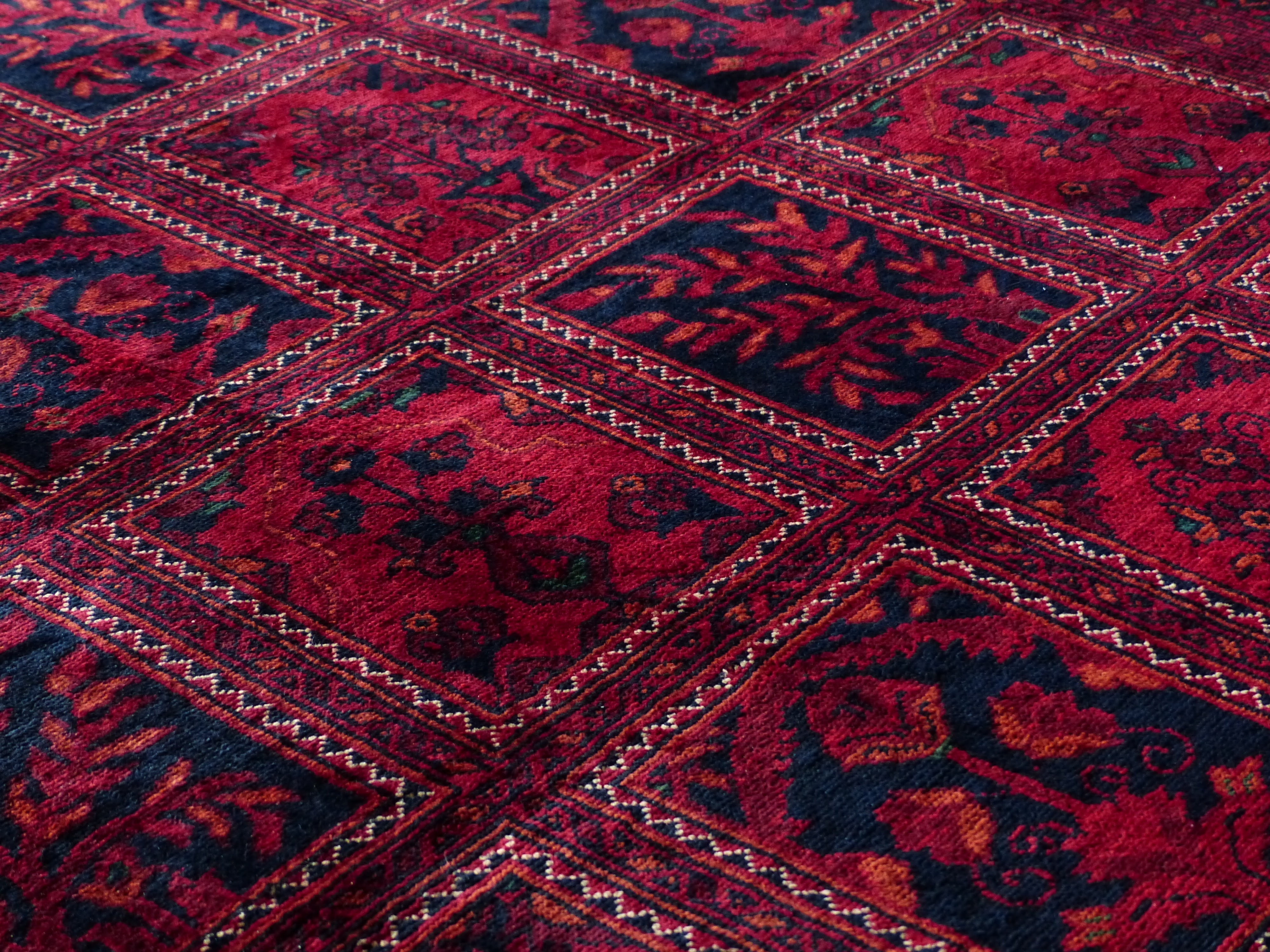 red and black floral area rug, carpet, tying, silk, wool, carpet weaving center