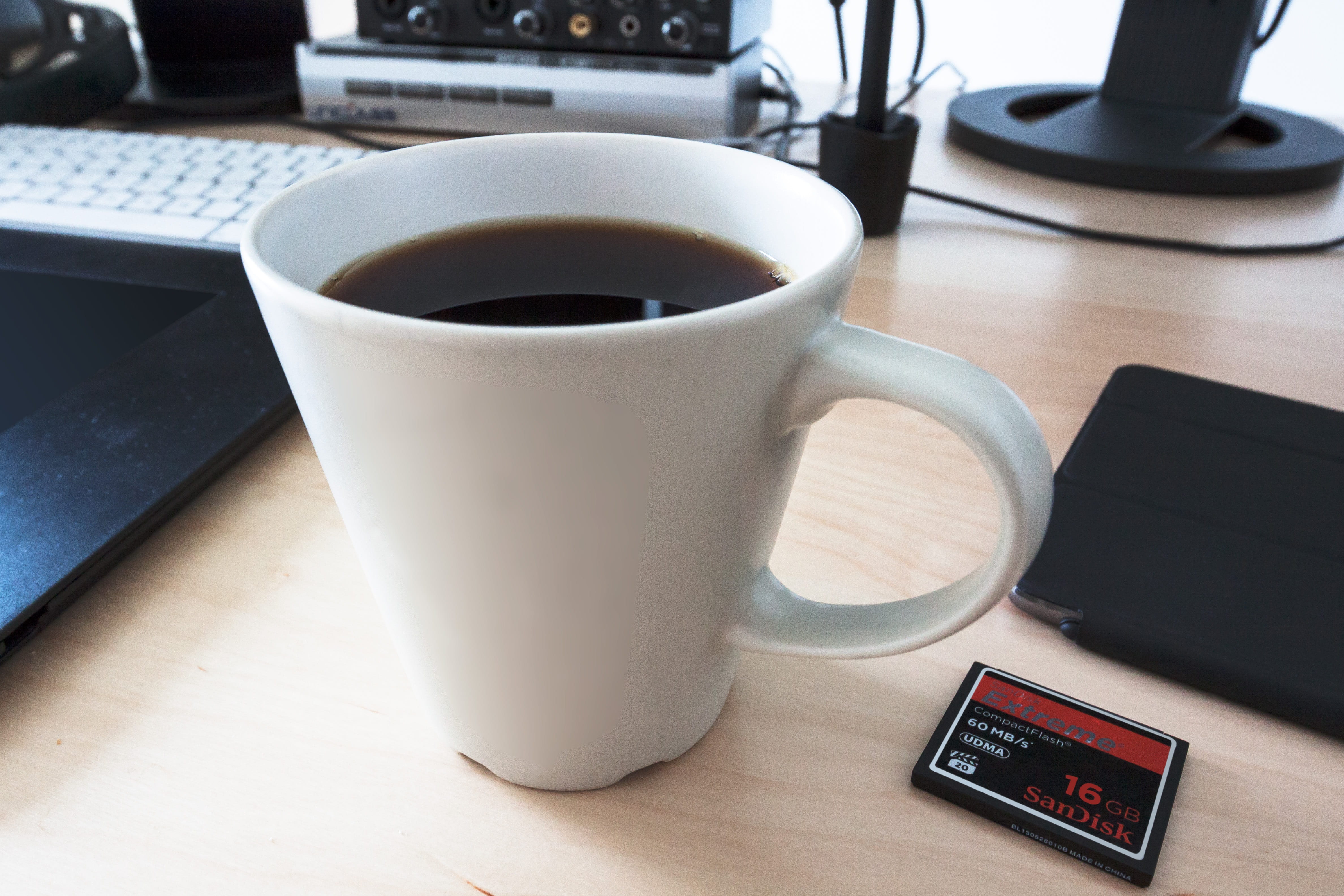 white ceramic mug filled with coffee on table, cup, workplace