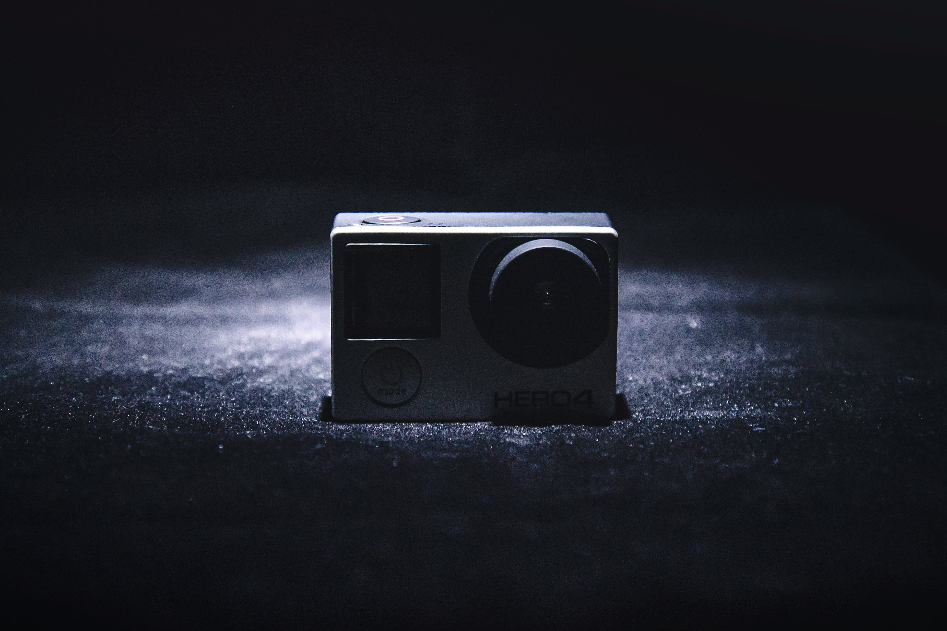 gray GoPro Hero 4 on black surface, camera, recording, videos