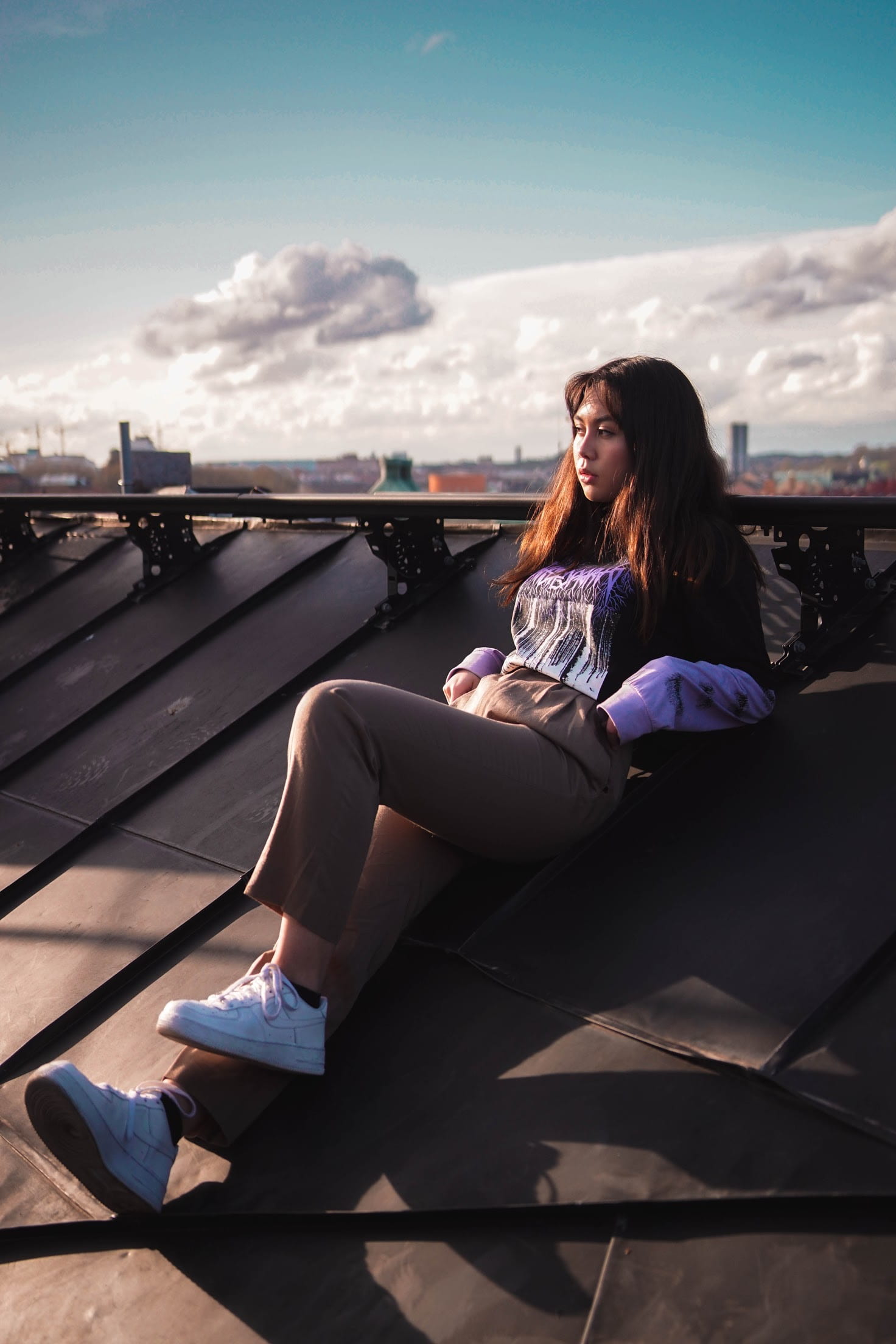 woman leaning on roof, woman lying on roof, portrait, style, rooftop