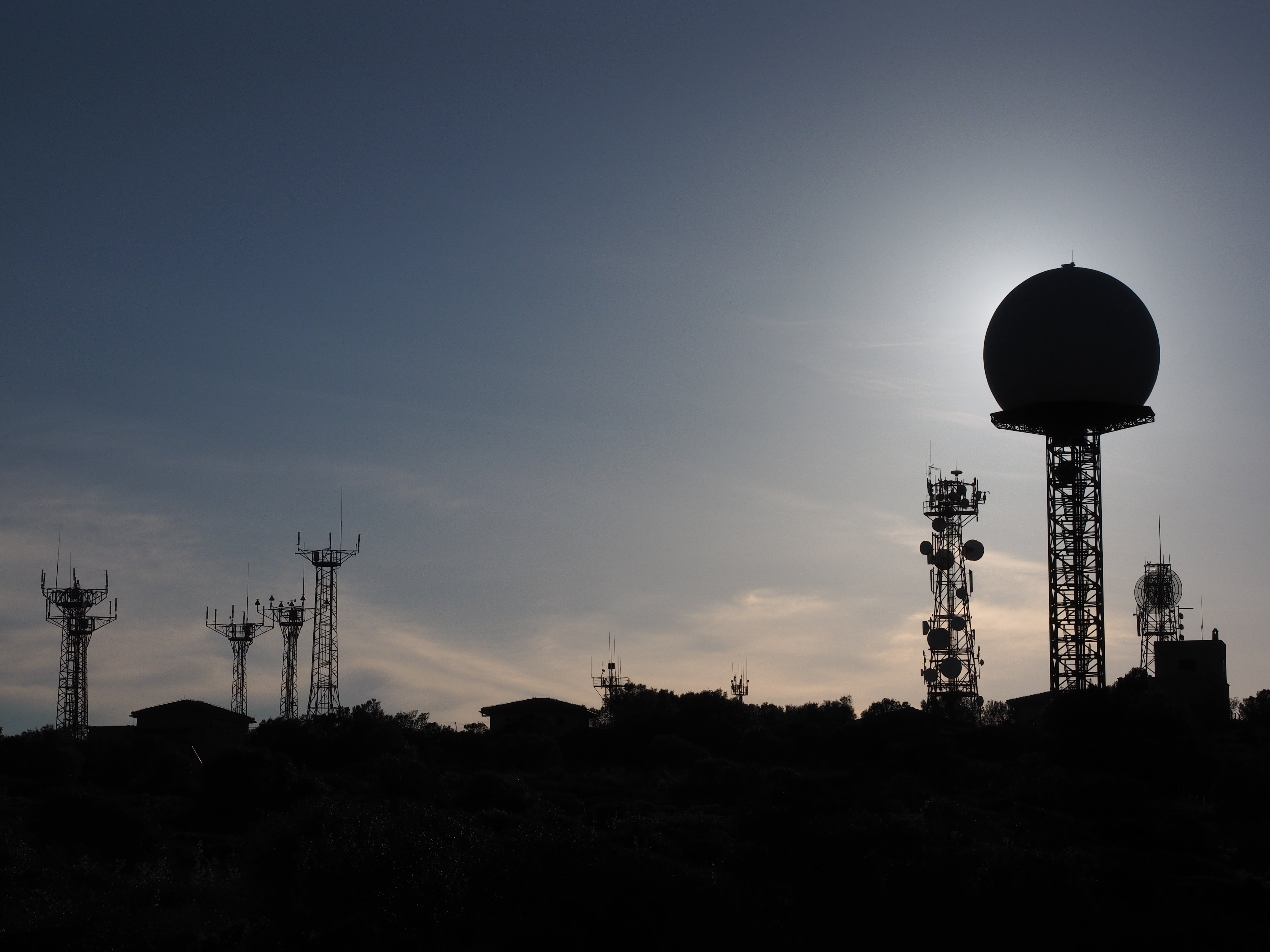 silhouette of tower at daytime, antennas, radar equipment, balloon-like