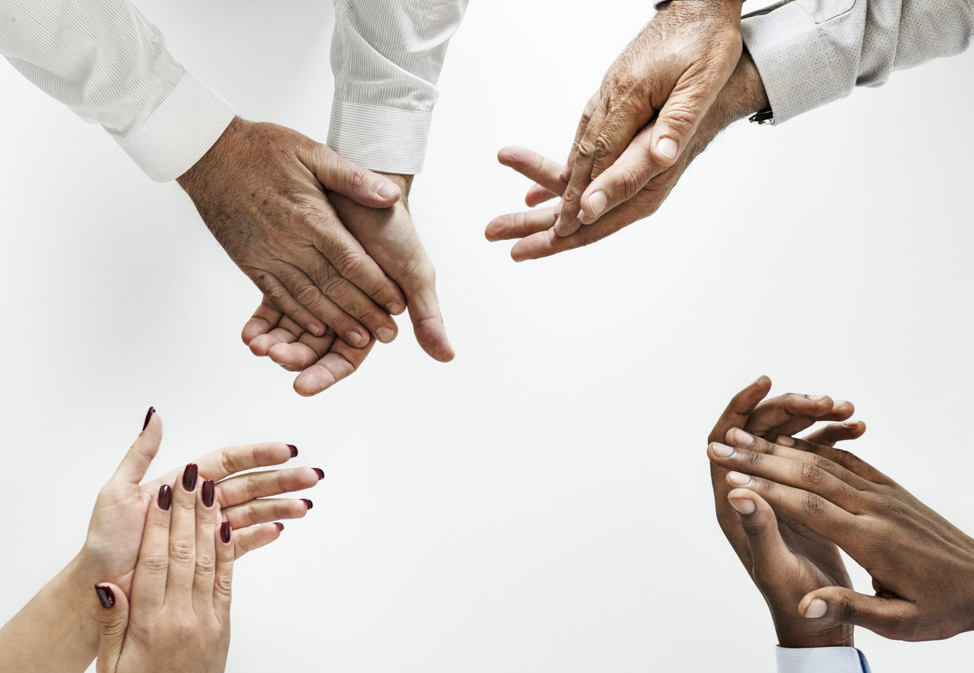four person's hand clapping against white background, teamwork
