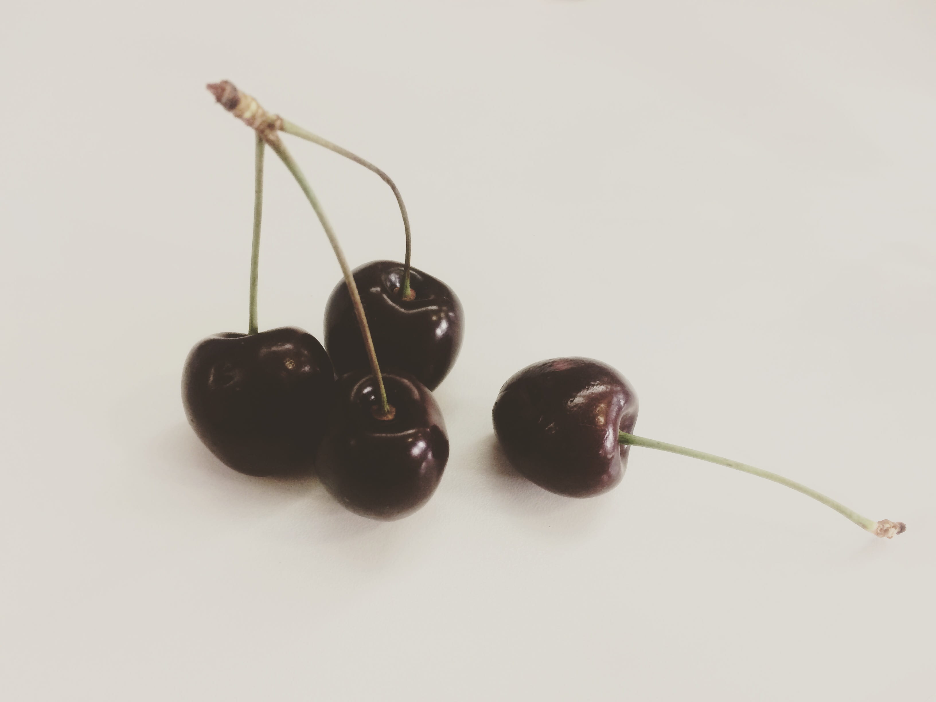 Cherries, cherries on white surface, cherry, fruit, stalk, stem