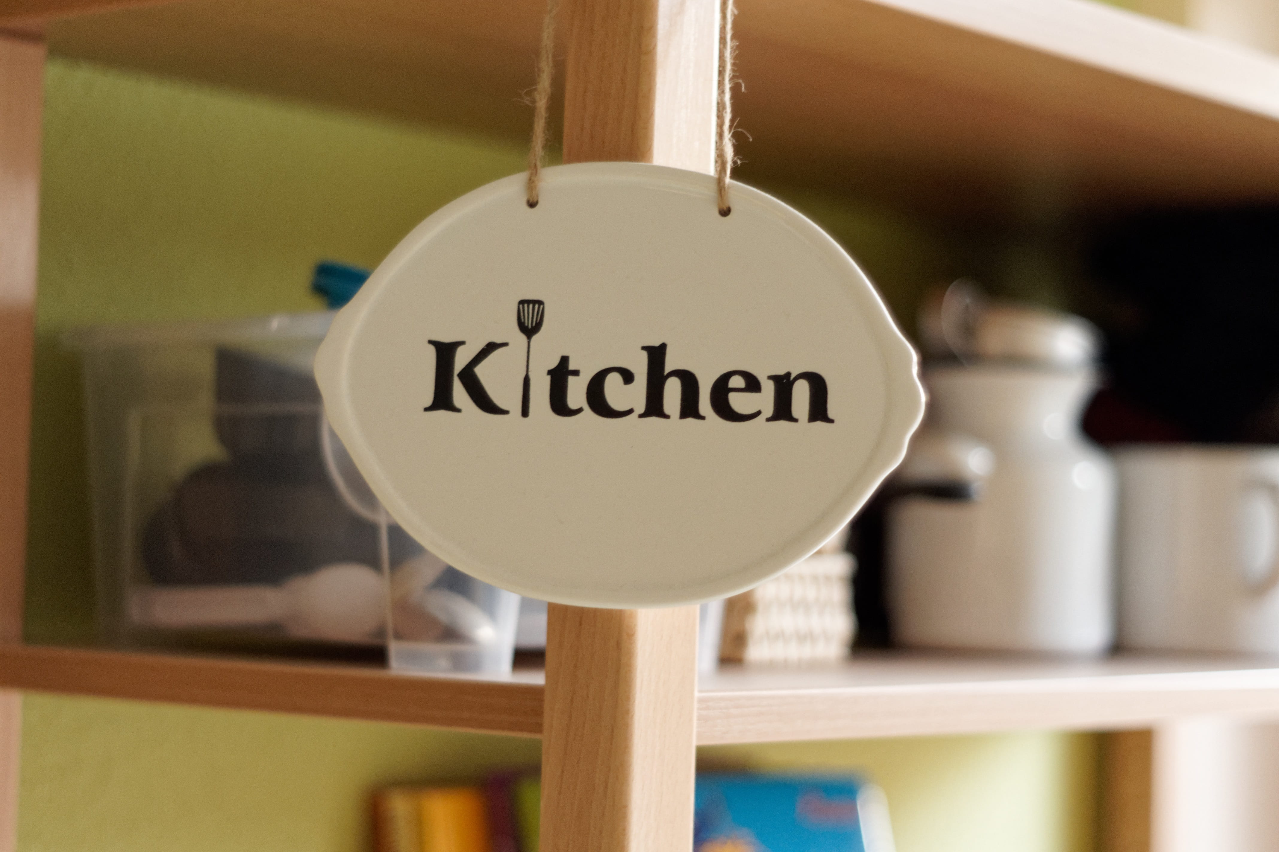 kitchen, shield, text, close-up, indoors, communication, hanging