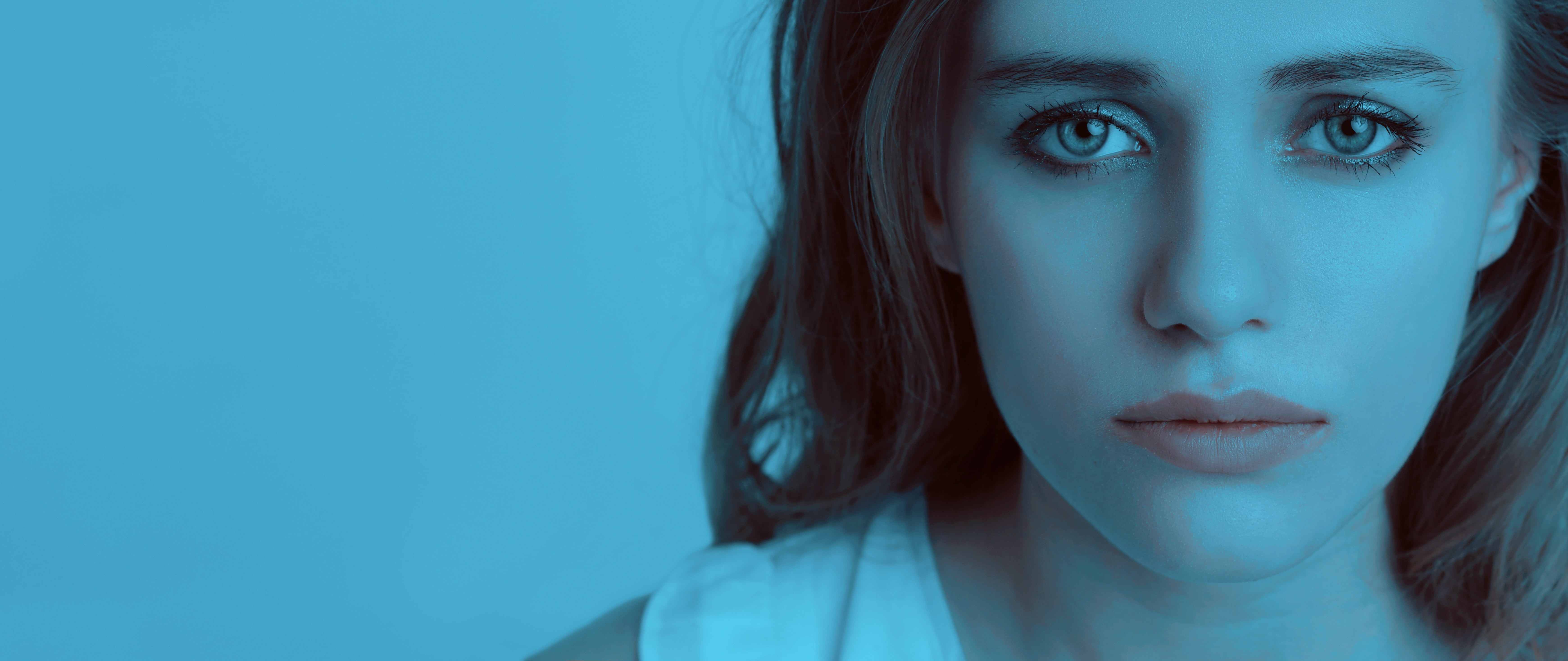 woman wearing white shirt with blue background, sad girl, girl crying