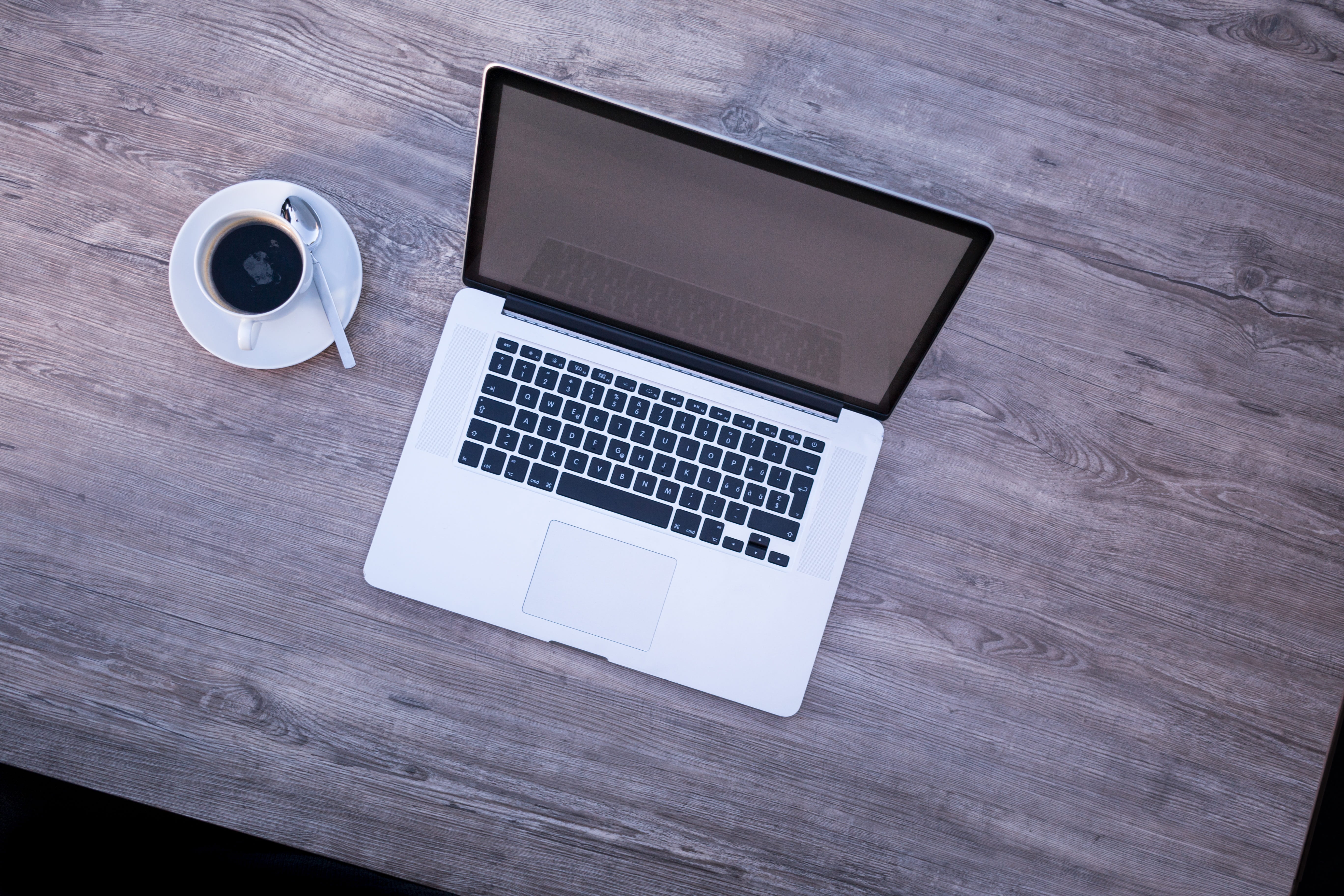 MacBook beside white coffee cup, laptop, mockup, webinar, open
