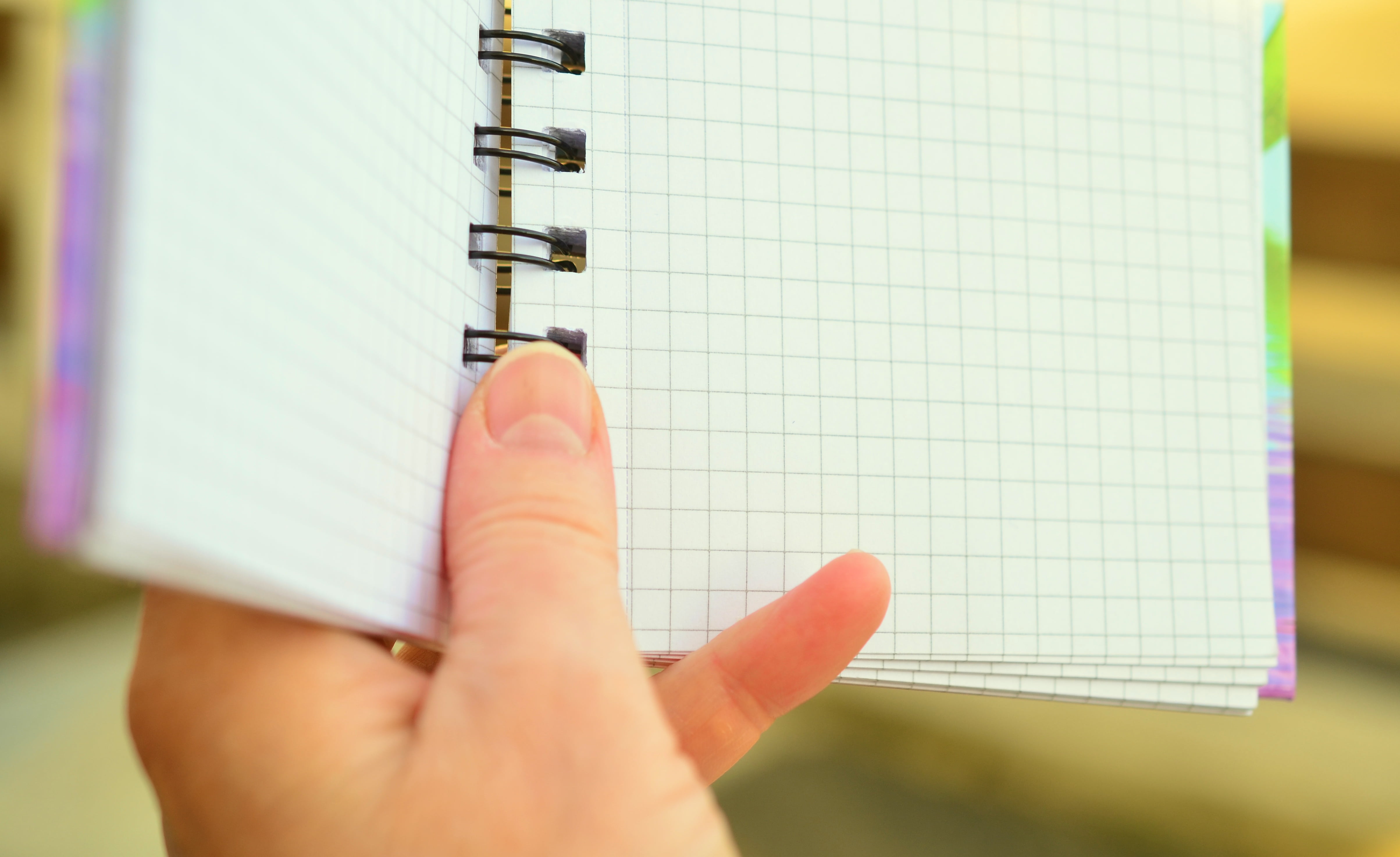 person holding spring notebook, dates, notes, notepad, planning