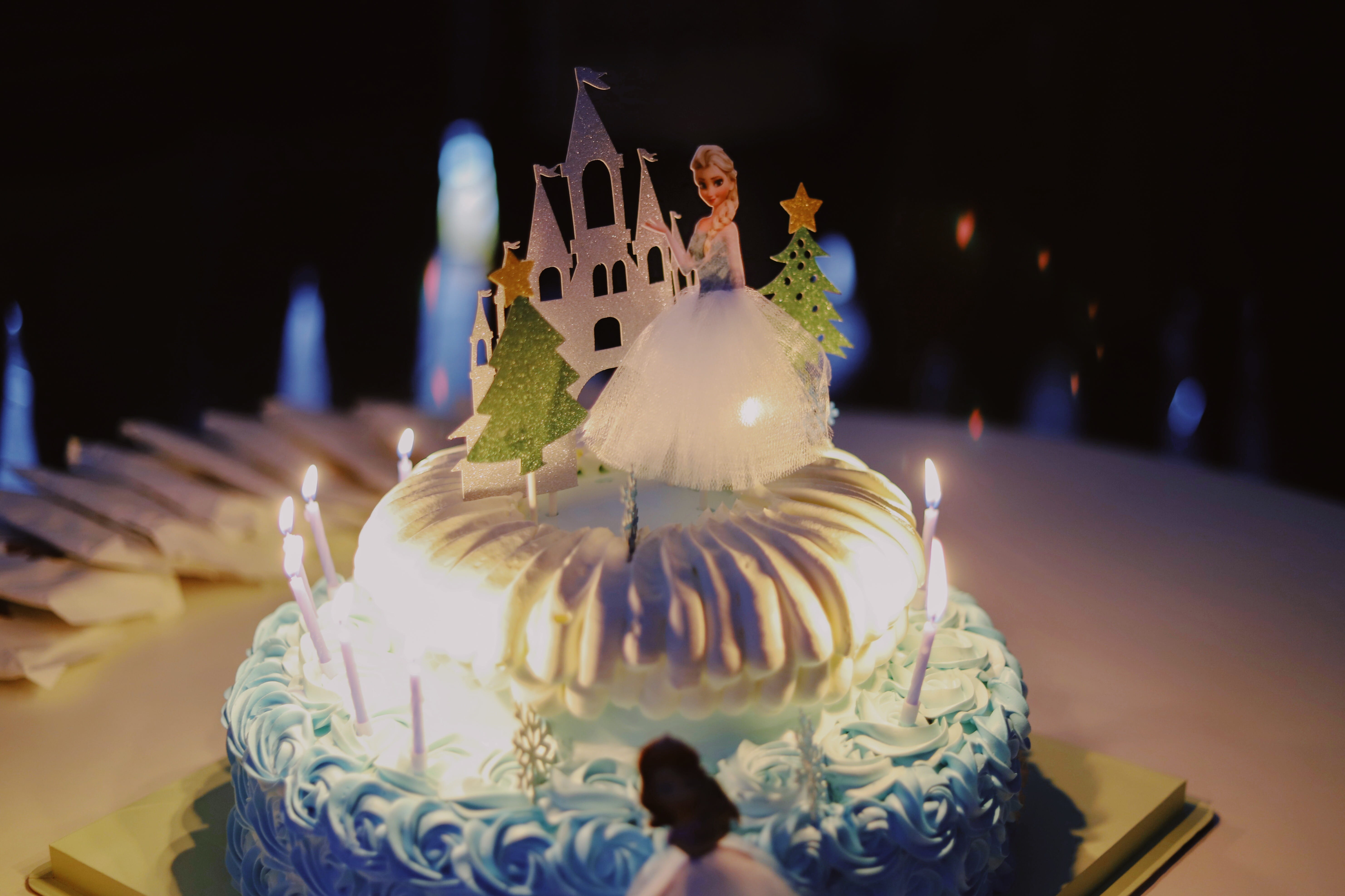 2-layer cake with lighted candles and Disney Frozen Queen Elsa cake topper, Disney Frozen Queen Elsa fondant cake