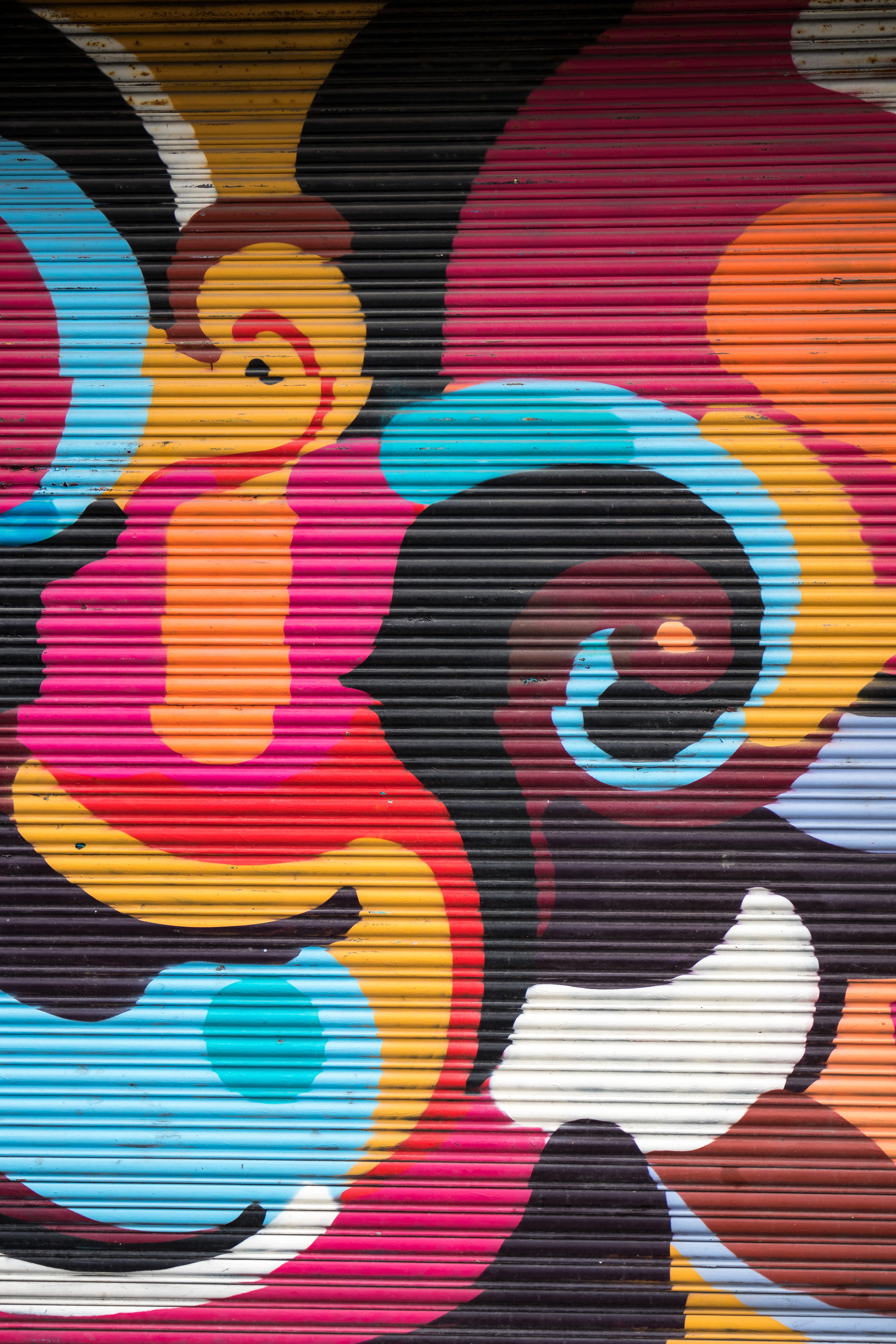 abstract painting, photo of roller shutter with mural artwork