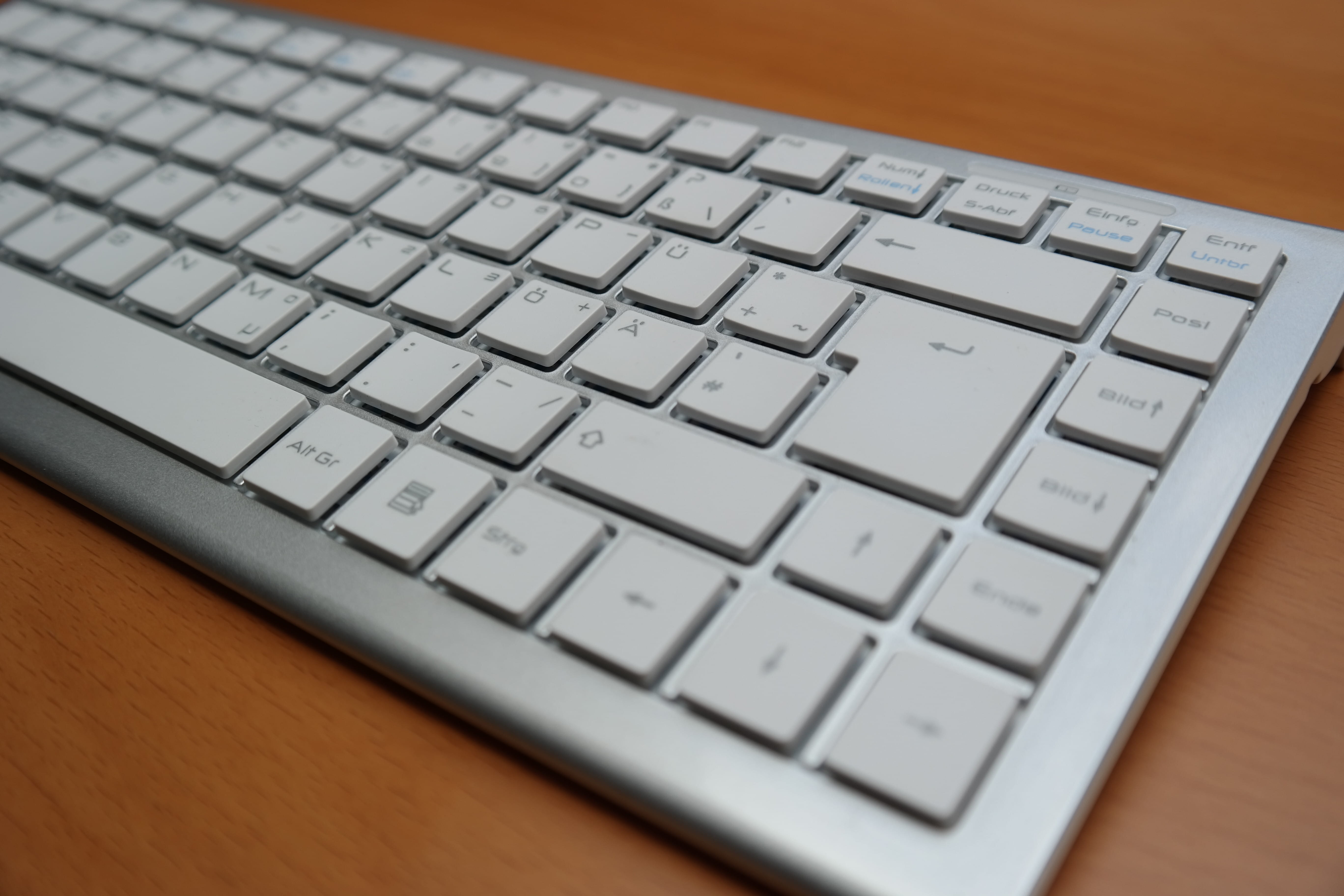 gray Apple Magic keybaord, return key, return button, enter button