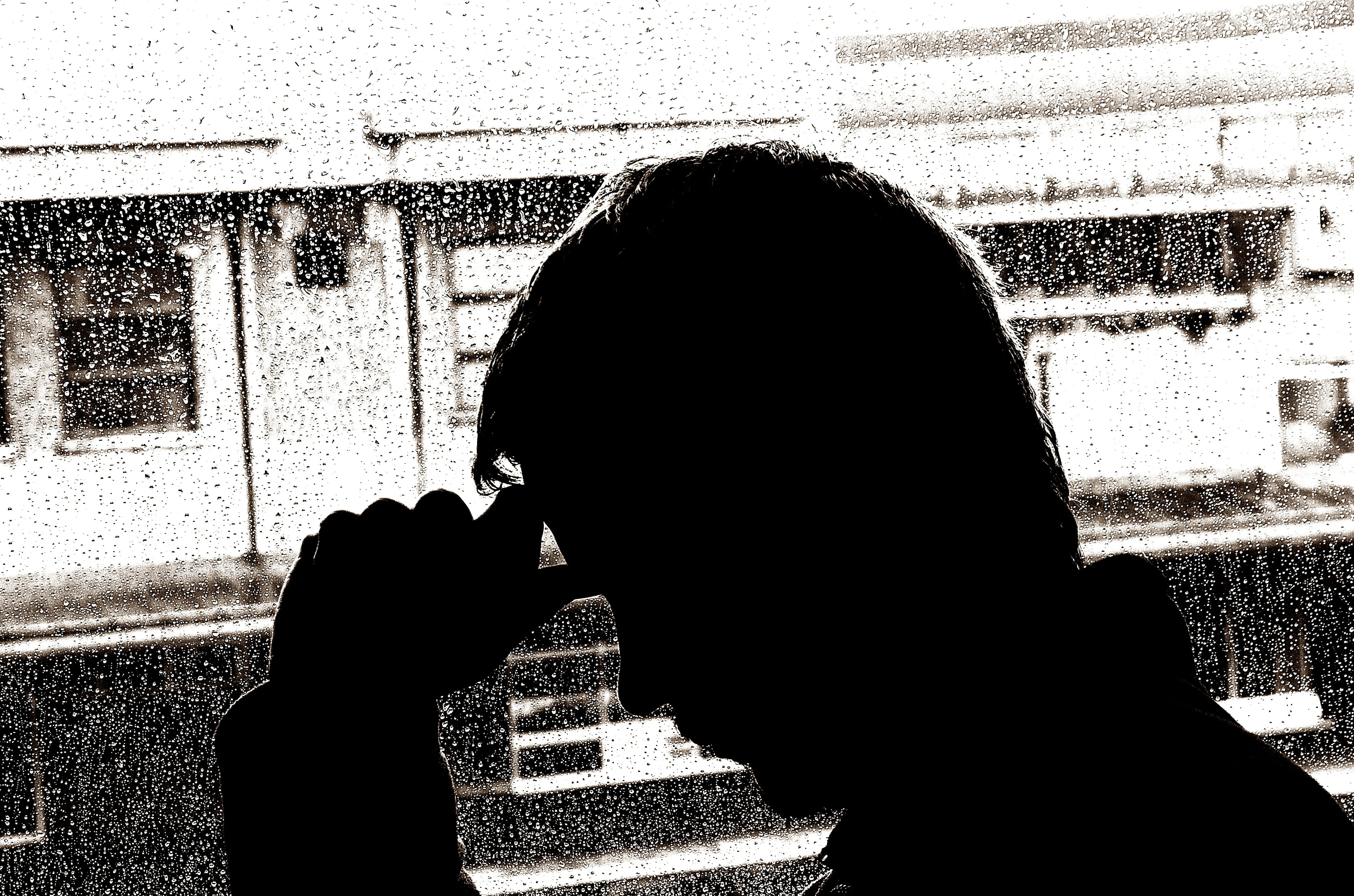 silhouette of man beside window panel, depression, marital, status