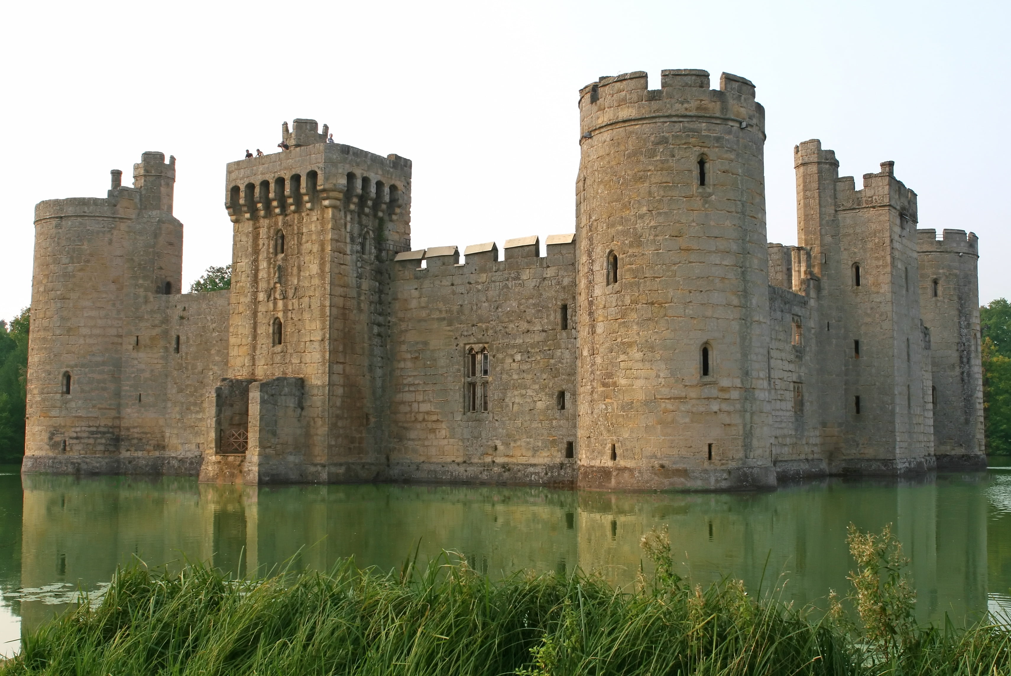 stone castle with water during daytime, battlements, blue, bodiam