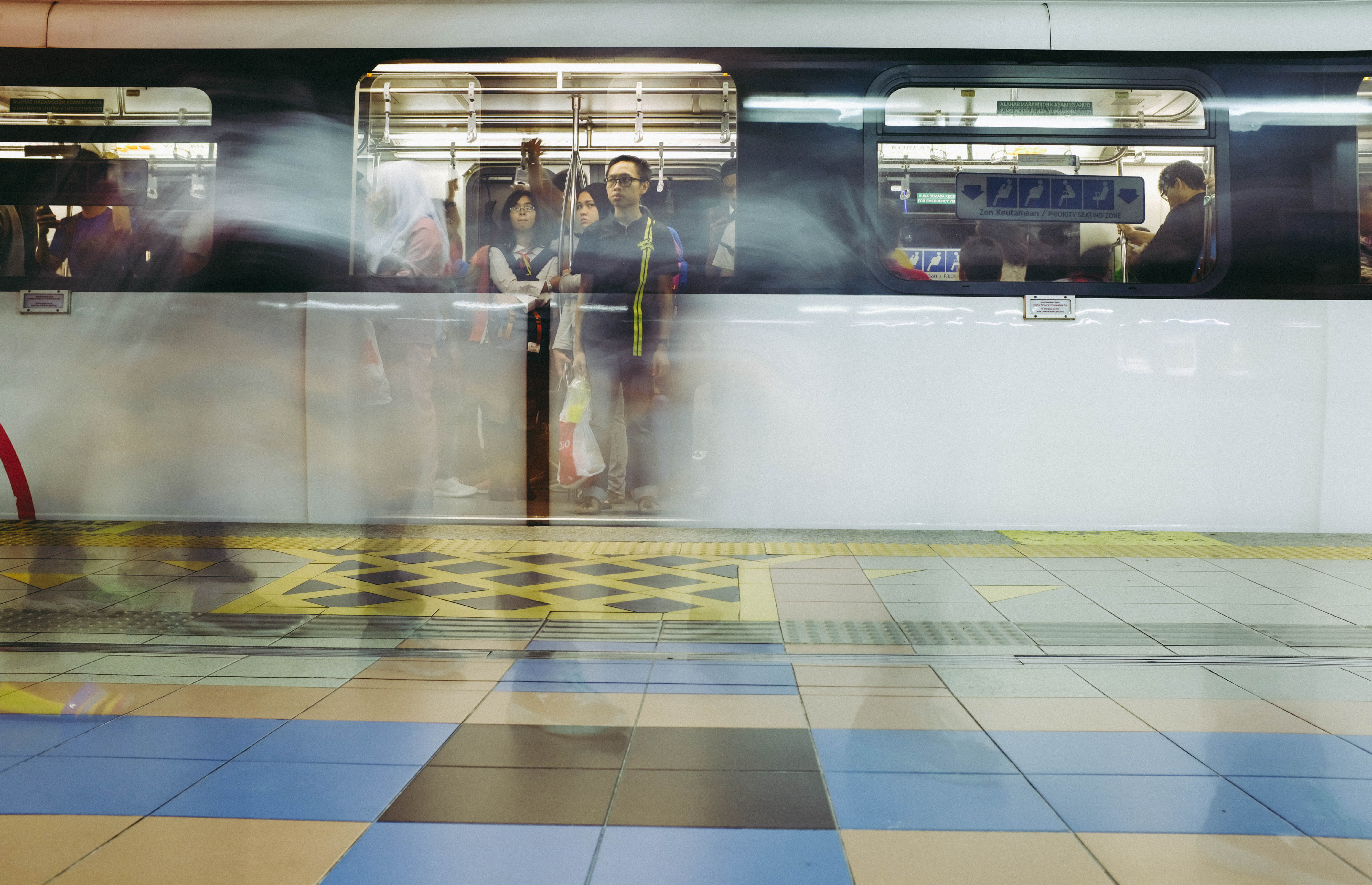 square yellow and blue tiles, window, reflection, train, underground