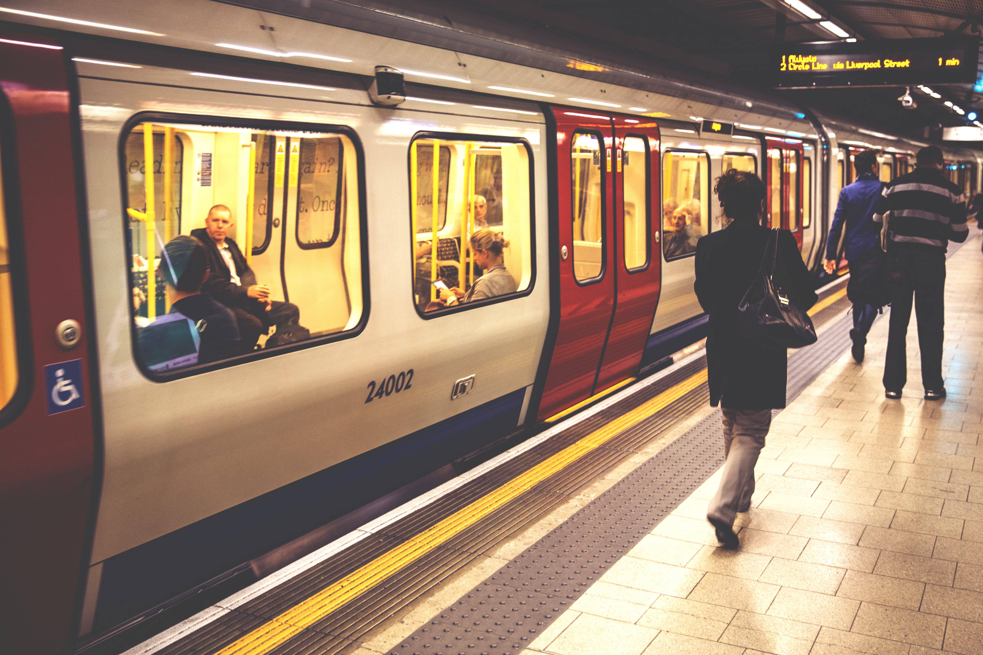 People walking along the platform on the London Underground, subway
