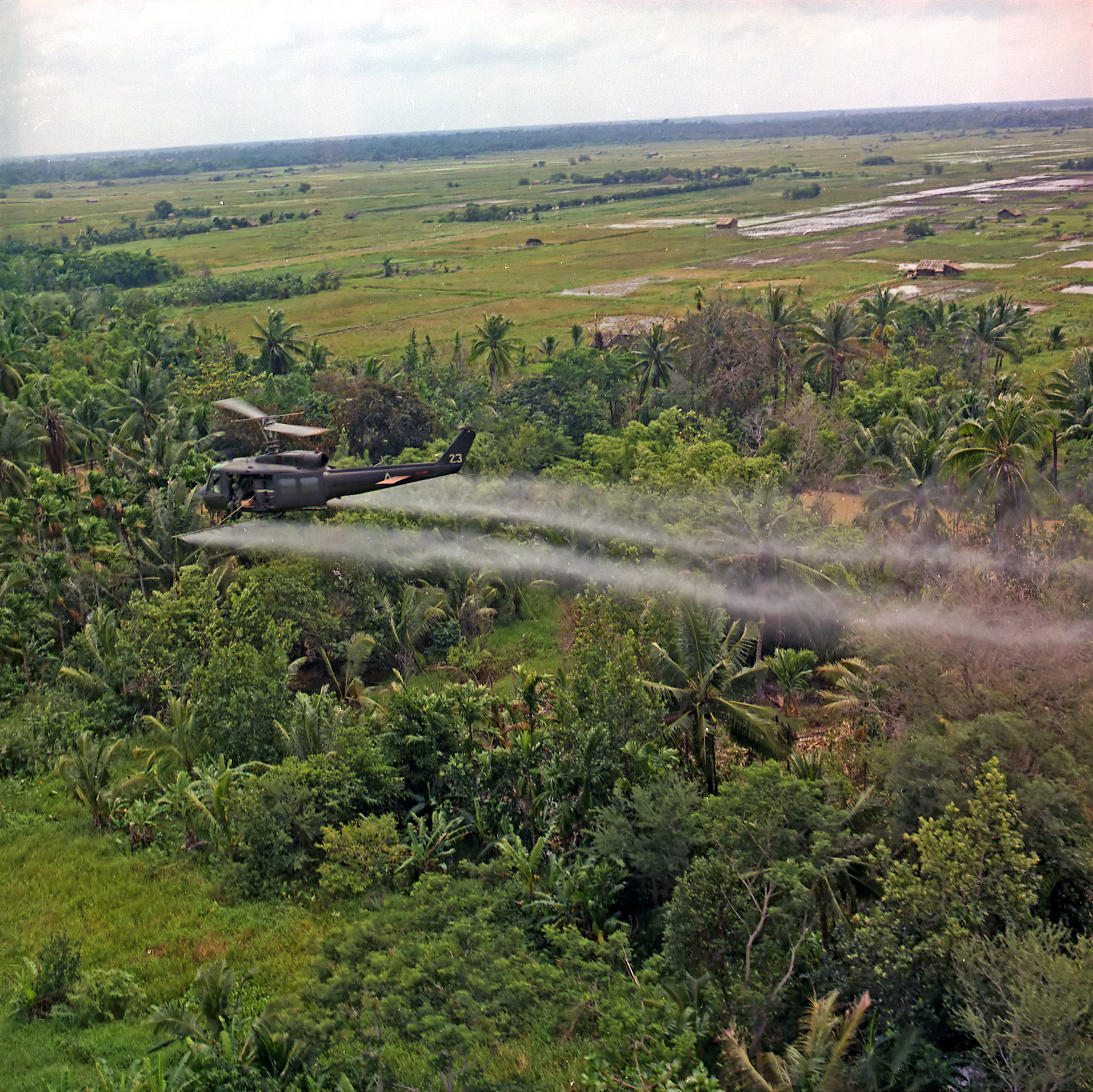 U.S. helicopter spraying chemical defoliants in the Mekong Delta during the Vietnam War