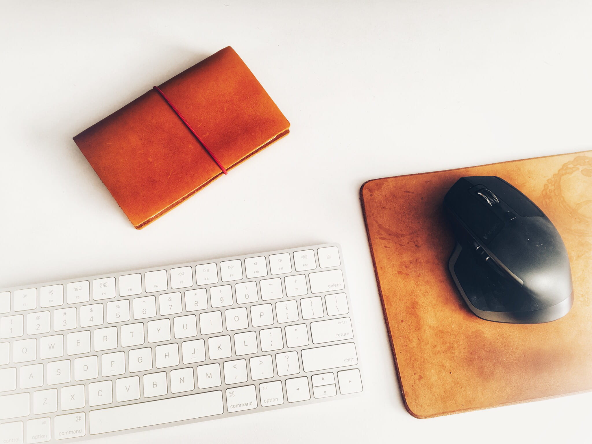 Analog x digital, silver Apple Magic Keyboard beside black wireless computer mouse