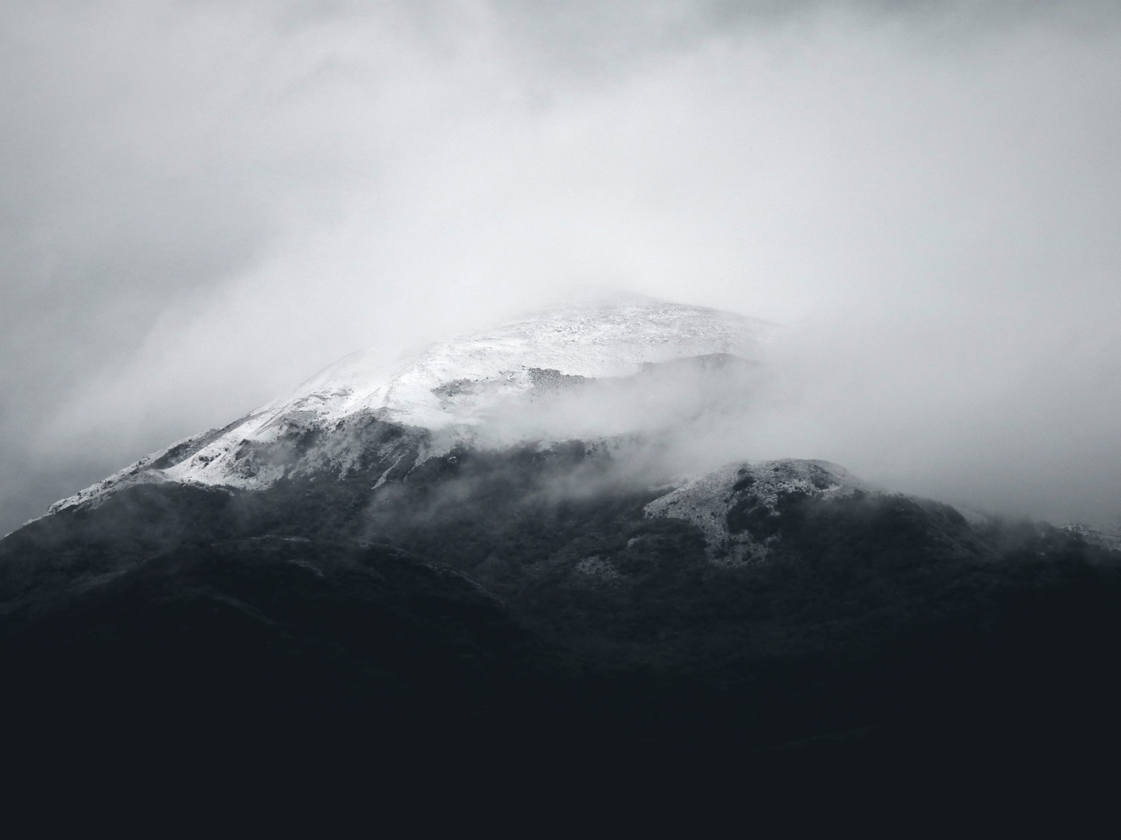 mountain surrounded with fogs, mountain covered with clouds, snow