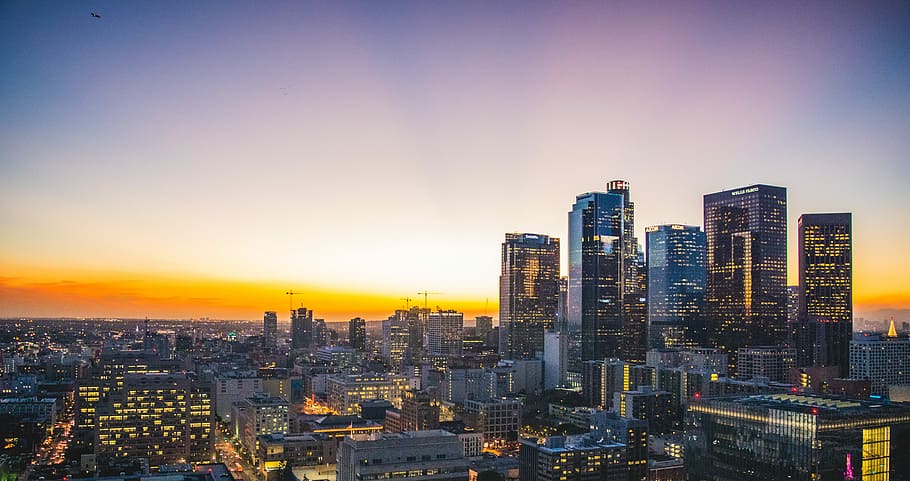 aerial photography of city buildings, city building photo during sunset HD wallpaper