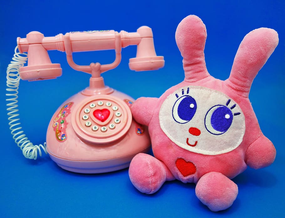 pink and white plush toy beside rotary phone, rabbit, bunny, stuffed bunny