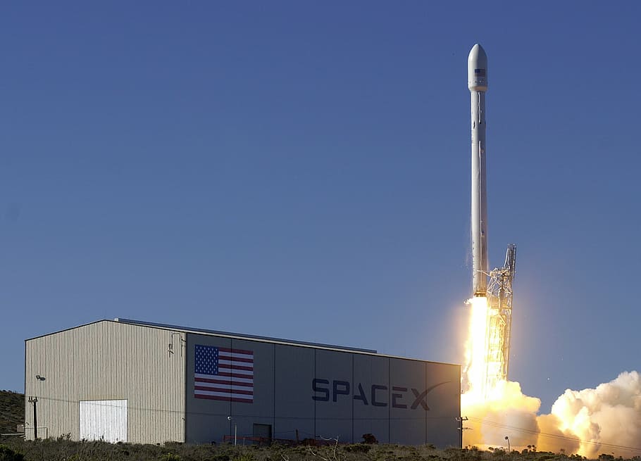 white rocket launch at daytime, lift-off, spacex, flames, propulsion