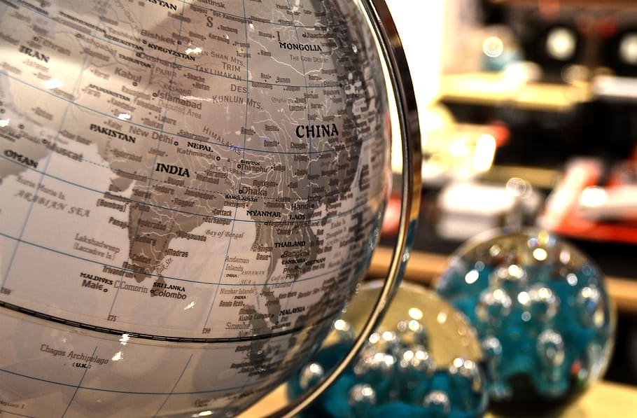 gray and silver world globe table decor, ball, atlas, office
