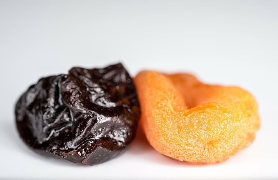 brown and orange dried fruits, dried apricots, prunes, yellow