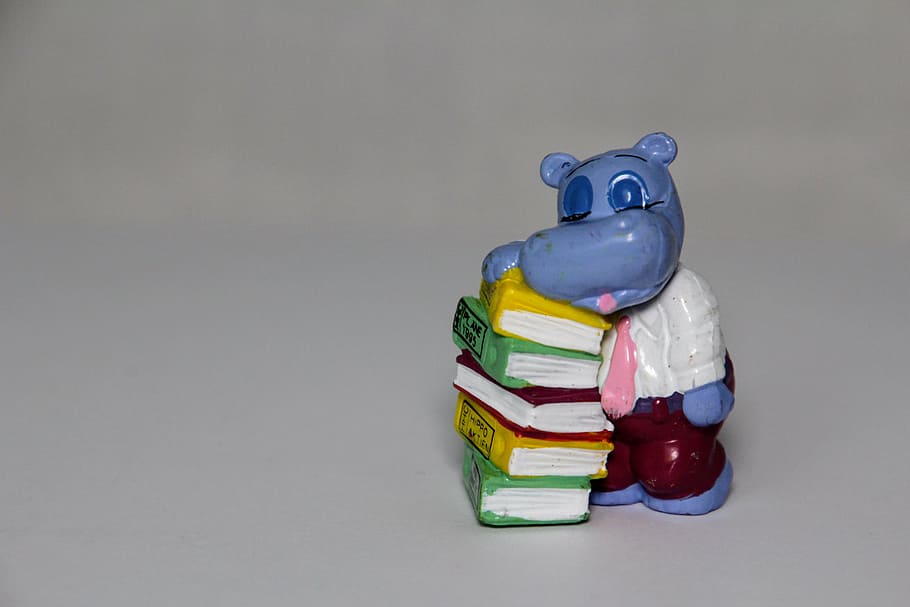 blue hippopotamus leaning on books table figurine, stack, exhausted HD wallpaper