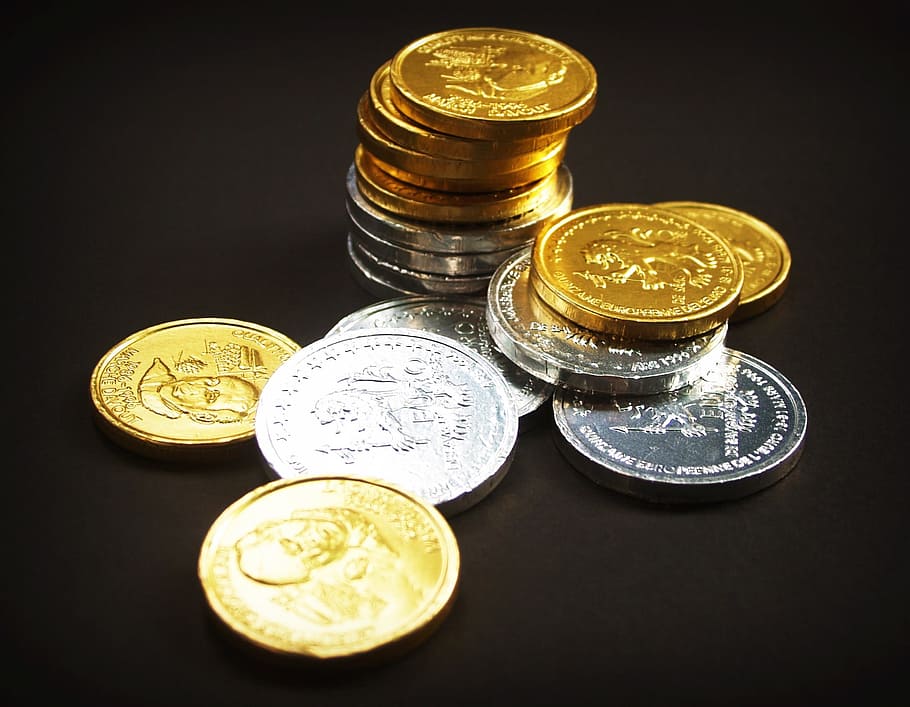 assorted round gold-colored and silver-colored coins on black surface, HD wallpaper