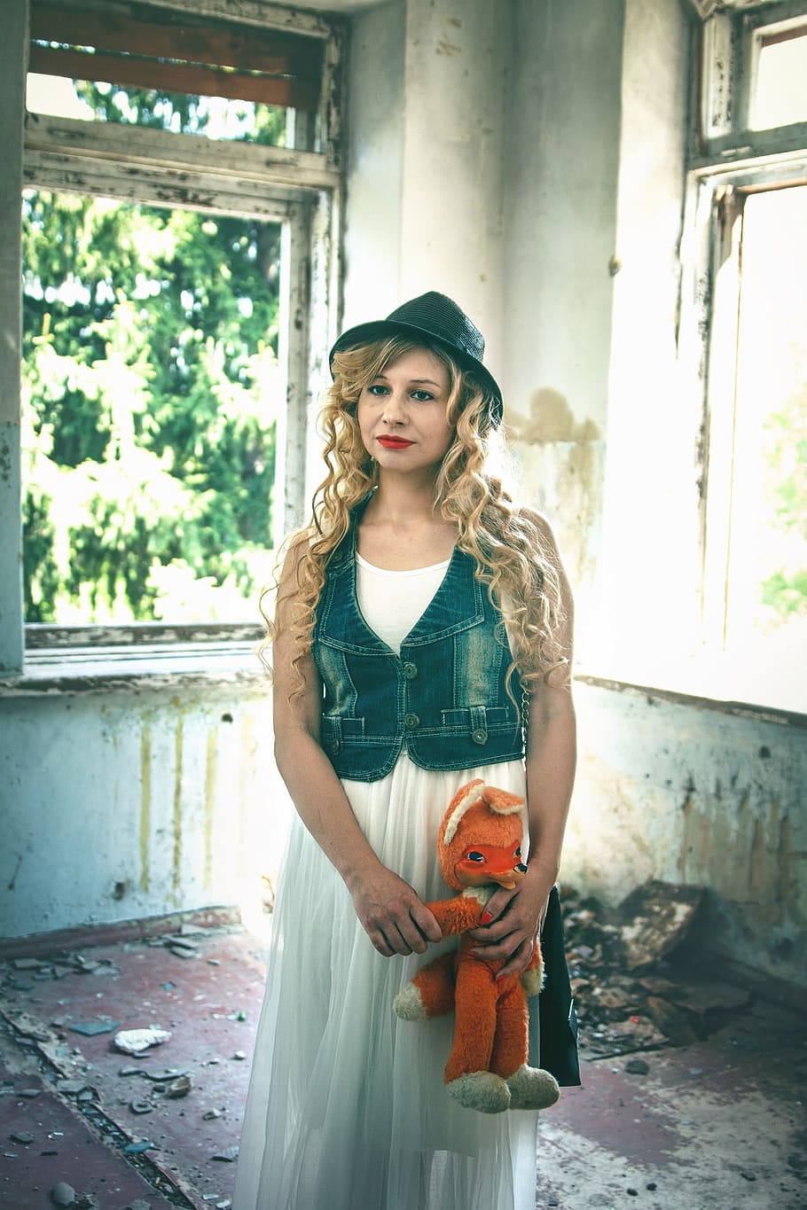 woman holding orange animal plush toy, fox, hat, building, structure HD wallpaper