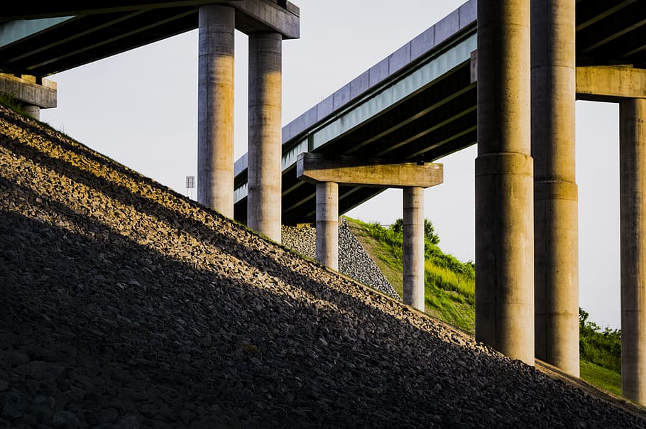 low-angle photography of concrete bridge, gray concrete building at daytime HD wallpaper