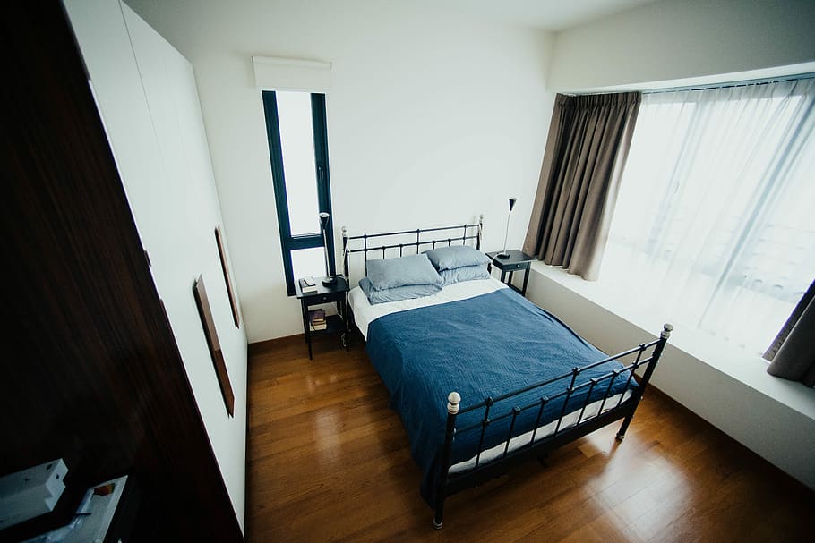 blue and white bed sheet and black bed frame in room, blue bed sheet and pillowcases HD wallpaper