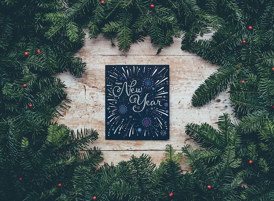 green New Year wreath on brown surface, card, board, garland HD wallpaper
